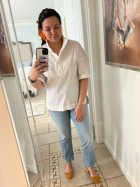 Crisp white top with a stand up collar, classic for casual or workday paired with Mother denim and Chloe Lauren scallop flats 
