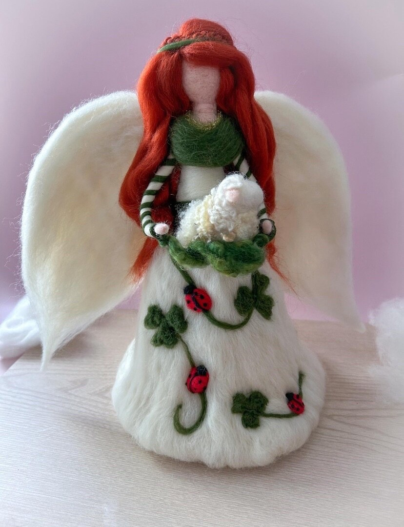 𝙽𝚎𝚎𝚍𝚕𝚎 𝚏𝚎𝚕𝚝𝚎𝚍 𝚏𝚛𝚘𝚖 𝚜𝚘𝚏𝚝 𝚖𝚎𝚛𝚒𝚗𝚘 𝚠𝚘𝚘𝚕 𝚊𝚗𝚍 𝚗𝚊𝚝𝚞𝚛𝚊𝚕 𝚏𝚒𝚋𝚎𝚛𝚜, 𝚝𝚑𝚒𝚜 𝙸𝚛𝚒𝚜𝚑 𝙲𝚑𝚛𝚒𝚜𝚝𝚖𝚊𝚜 𝙰𝚗𝚐𝚎𝚕 𝚌𝚎𝚕𝚎𝚋𝚛𝚊𝚝𝚎𝚜 𝚝𝚑𝚎 𝚓𝚘𝚢 𝚘𝚏 𝚠𝚒𝚗𝚝𝚎𝚛 𝚊𝚗𝚍 𝚝𝚑𝚎 𝚙𝚛𝚘𝚖𝚒𝚜𝚎 𝚘𝚏 𝚜𝚙𝚛𝚒𝚗𝚐. 𝙷𝚎𝚛 𝚏𝚕𝚘𝚠𝚒𝚗𝚐 𝚠𝚑𝚒𝚝𝚎 𝚐𝚘𝚠𝚗 𝚒𝚜 𝚊𝚍𝚘𝚛𝚗𝚎𝚍 𝚠𝚒𝚝𝚑 𝚏𝚎𝚕𝚝𝚎𝚍 𝚜𝚑𝚊𝚖𝚛𝚘𝚌𝚔𝚜 𝚊𝚗𝚍 𝚌𝚑𝚎𝚎𝚛𝚏𝚞𝚕 𝚕𝚊𝚍𝚢𝚋𝚞𝚐𝚜, 𝚜𝚢𝚖𝚋𝚘𝚕𝚜 𝚘𝚏 𝚐𝚘𝚘𝚍 𝚏𝚘𝚛𝚝𝚞𝚗𝚎 𝚊𝚗𝚍 𝚛𝚎𝚗𝚎𝚠𝚊𝚕. 𝚂𝚑𝚎 𝚑𝚘𝚕𝚍𝚜 𝚊 𝚝𝚒𝚗𝚢 𝚠𝚘𝚘𝚕 𝚜𝚑𝚎𝚎𝚙 𝚒𝚗 𝚑𝚎𝚛 𝚊𝚛𝚖𝚜 — 𝚊 𝚝𝚎𝚗𝚍𝚎𝚛 𝚗𝚘𝚍 𝚝𝚘 𝚝𝚑𝚎 𝙸𝚛𝚒𝚜𝚑 𝚌𝚘𝚞𝚗𝚝𝚛𝚢𝚜𝚒𝚍𝚎.

#LTKHome #LTKU #LTKHoliday