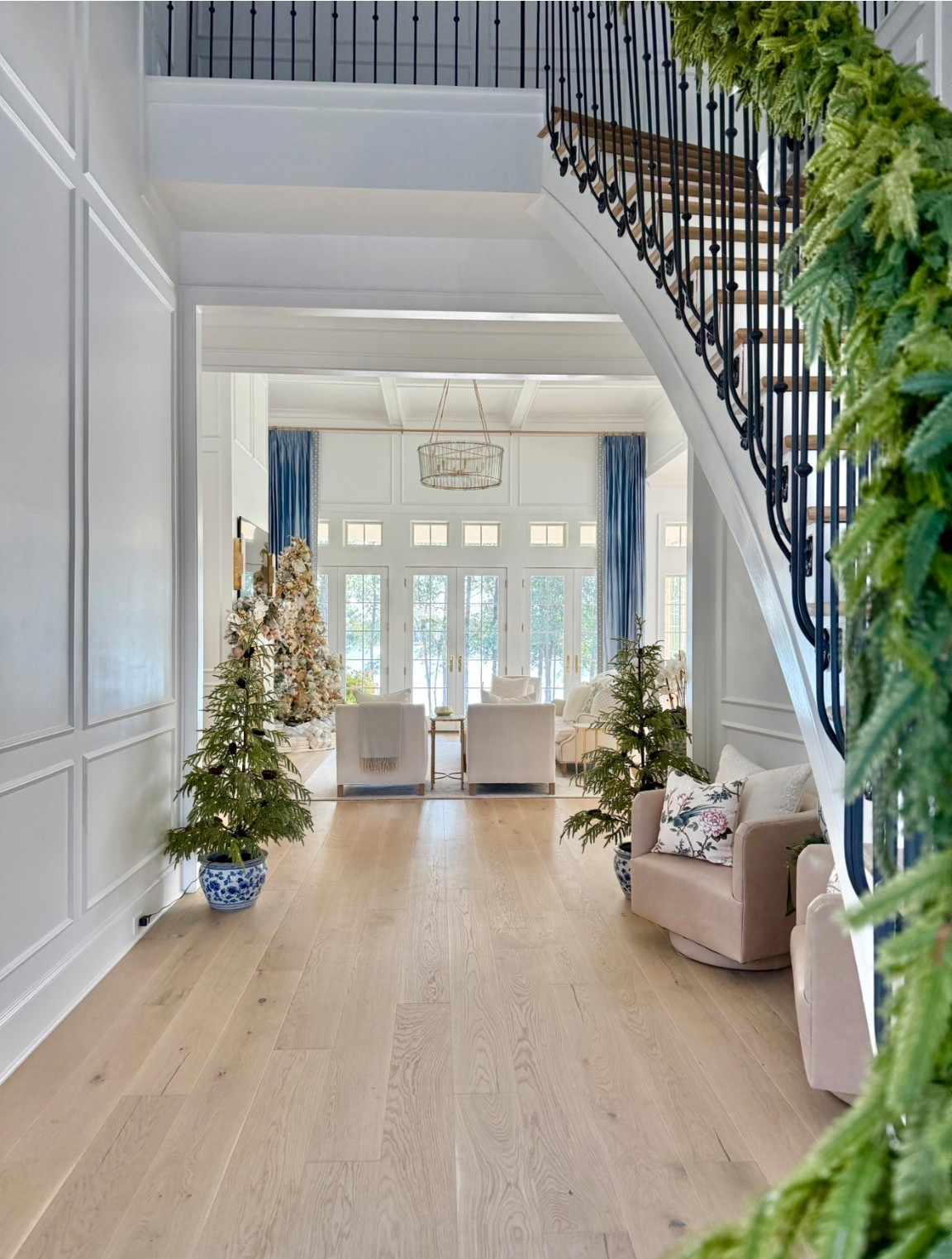 Christmas entryway 
Planters, trees, chairs 