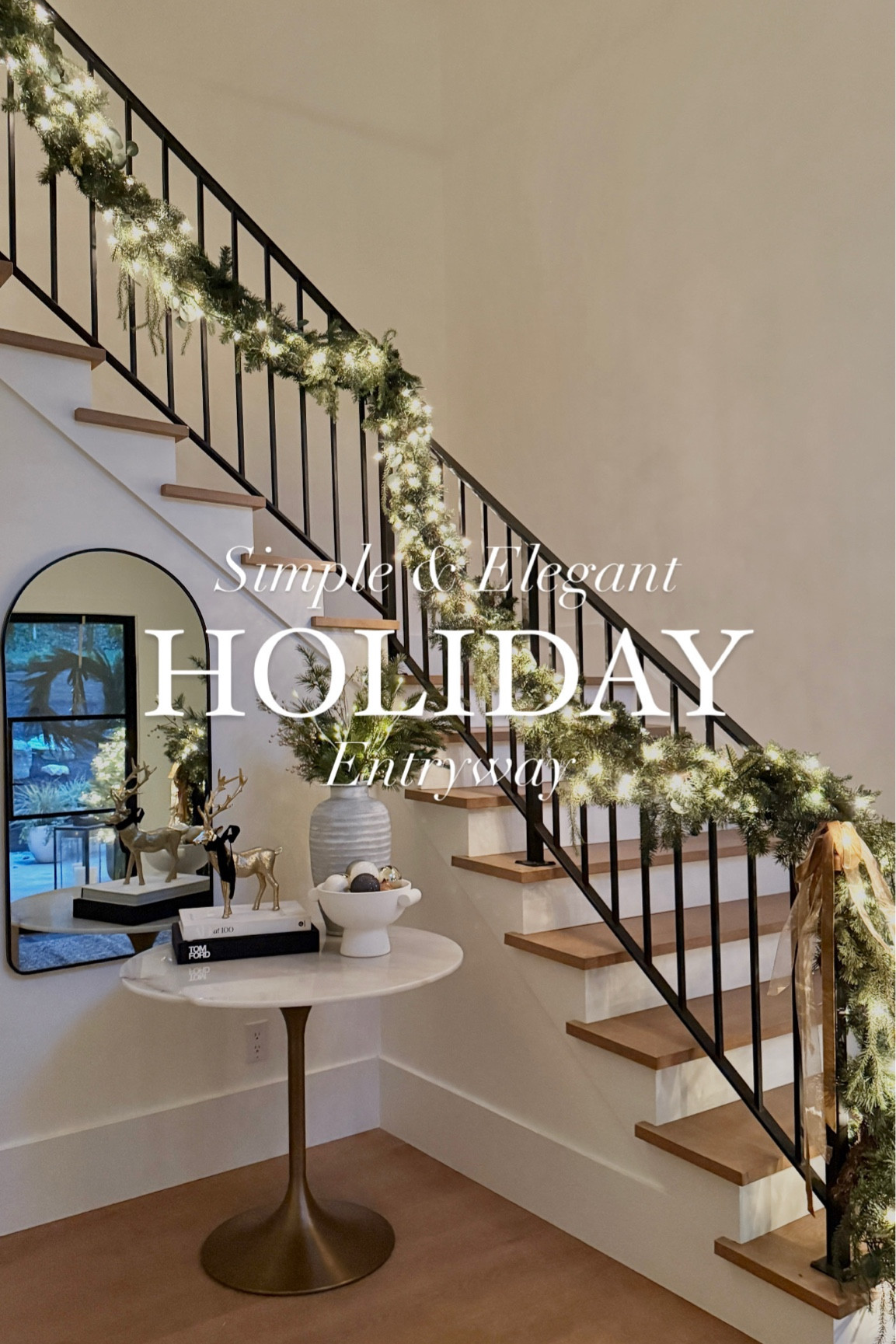 Simple & Elegant Holiday Entryway! ✨

I absolutely adore how my staircase and entryway look this holiday season! I started by twisting two pine garlands together and wrapping with Christmas lights. To secure to your railing, use fishing line! I added some bows & bells to add dimension.

For my entry vase, I mixed pine branches, white berry stems and my favorite $3 Target light-up sticks. Add a few coffee table books and a reindeer & you’re set! Super simple, super timeless. 🤍
holiday decor, holiday entryway, christmas staircase, holiday railing, interior design, #holidaygarland #christmasgarland #staircasestyling #holidaystaircase #christmasstyle #christmasstaircase #holidaystyle #christmasdecor 

#LTKHoliday #LTKSeasonal #LTKHome