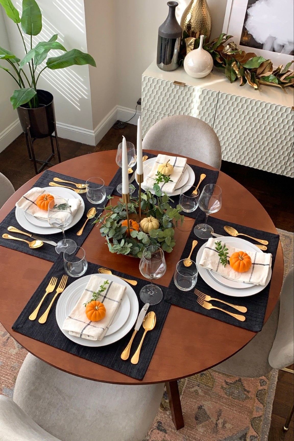 Hosting Thanksgiving in NYC! 

Table setting
Tablescape
Holiday dinner
Gold silverware 
Wine glasses 
Dinner plates
Faux plant
Wood bowl
Candlesticks
Home
Wreath
Garland
Home decor#LTKunder50

#LTKHoliday #LTKhome