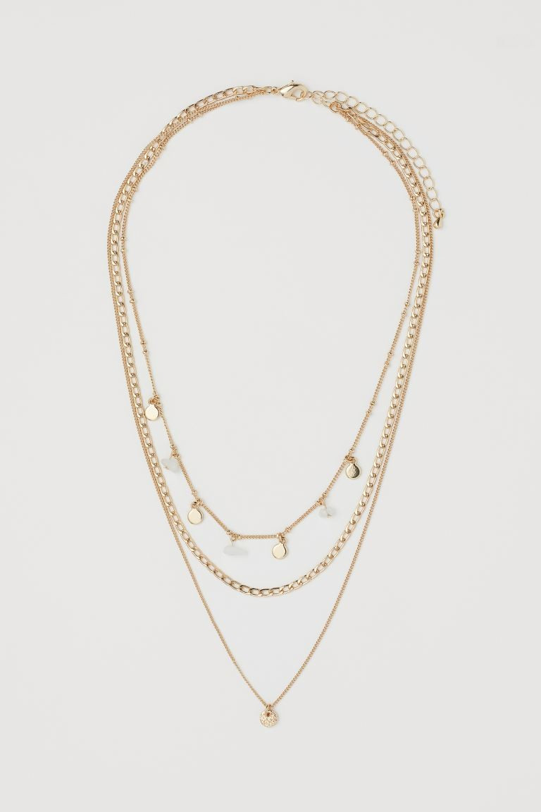 Triple-strand necklace of metal chains in various designs. Longest chain with a small, coin-shape... | H&M (US + CA)