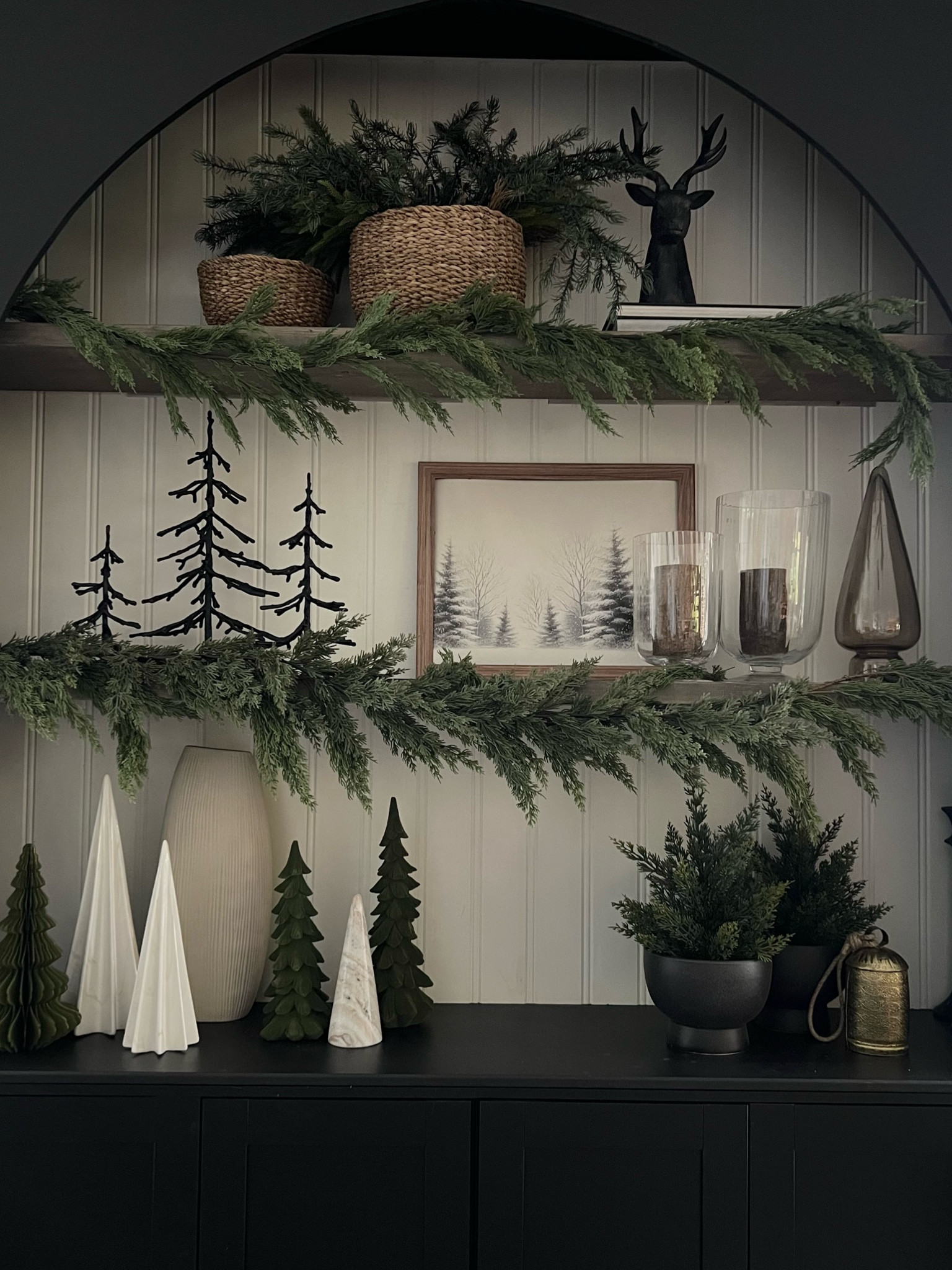 Holiday shelf styling🤎
Greenery, sculpted and cone trees, winter print, candles.... love this natural and slightly moody look! 
Christmas decor, neutral and natural! 
Shelf styling 

#LTKSeasonal #LTKHome #LTKHoliday