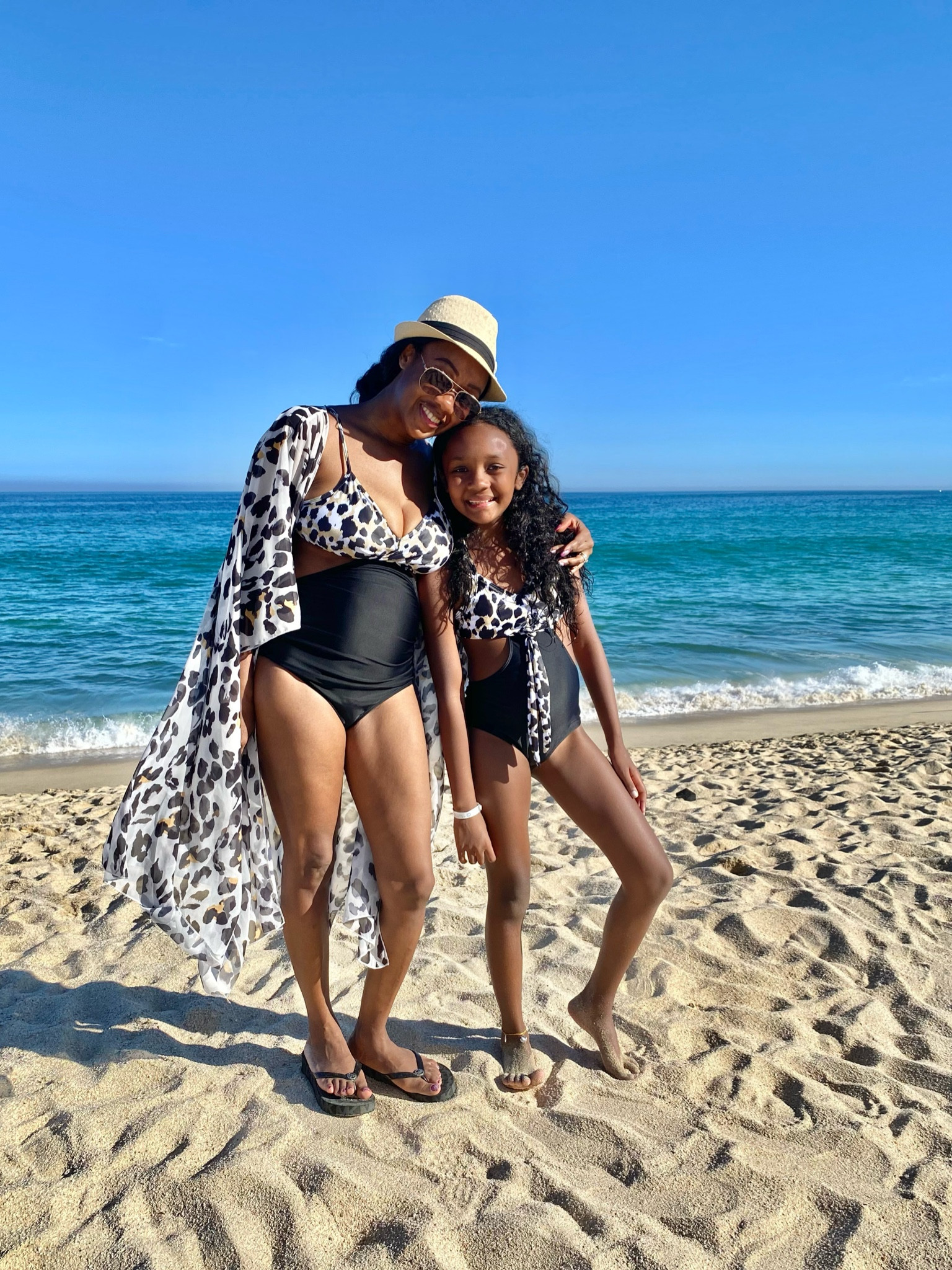 Lovely leopard print mommy and me matching swimsuits and overlay. 🖤🐆#LTKFind

#LTKtravel #LTKswim