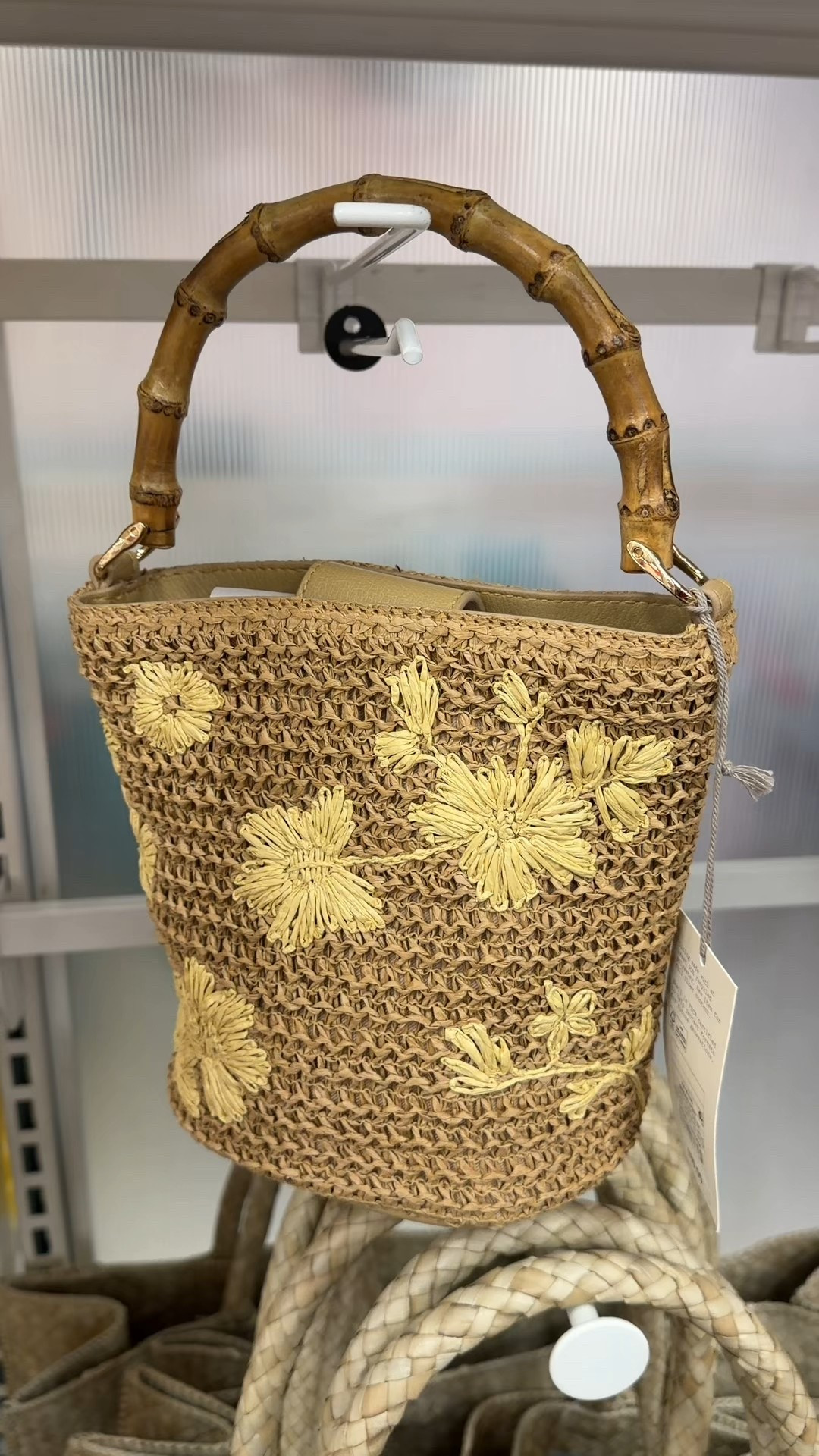 New at Target! 🌼 The Straw Floral Embroidered Bucket Bag from A New Day is such a pretty summer accessory. ☀️ The floral embroidery adds soft detail, and the faux bamboo top handle gives it that elevated, resort-inspired feel. 🤎 Easy to style with dresses, denim, or linen sets. And at $30, it’s a great getaway bag! Linked it here! 🤗 #TargetFinds  #SummerBag #VacationStyle

#LTKootd #LTKSaleAlert #LTKSeasonal