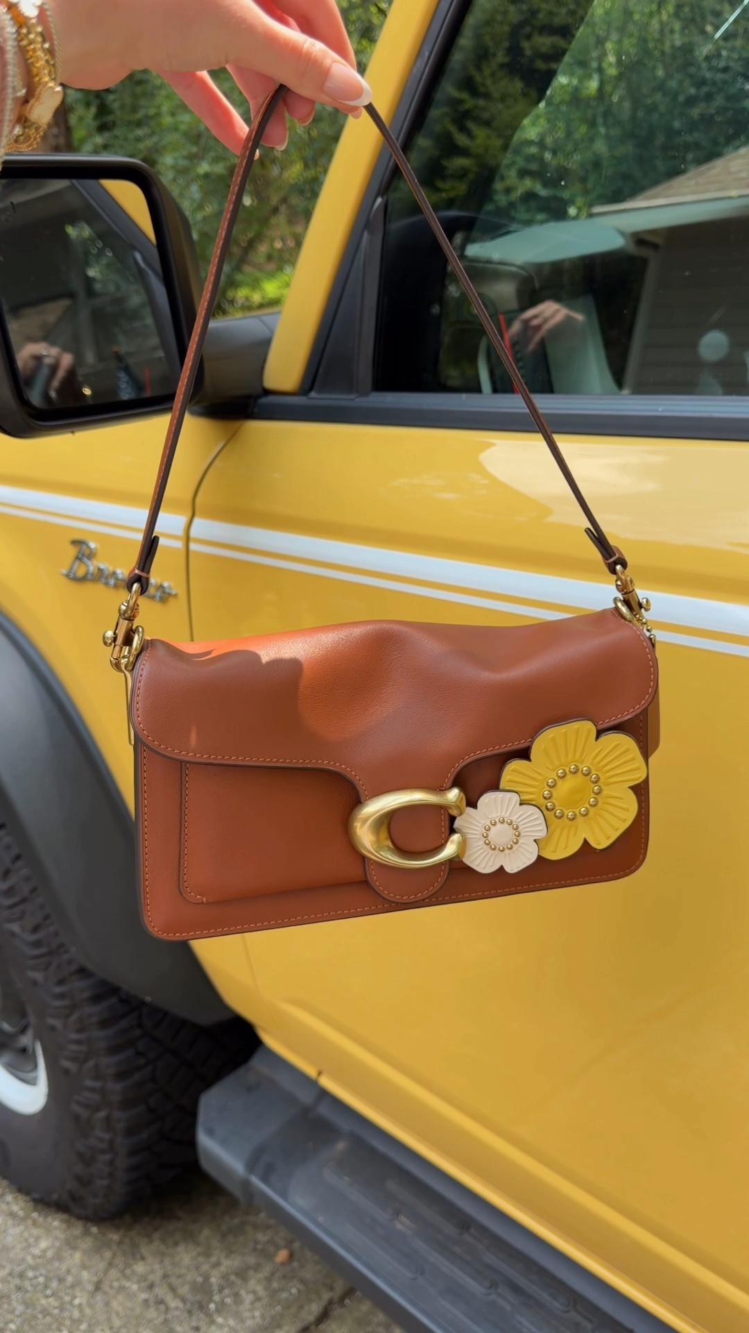 I recently went to the Coach Play store in Atlanta for their grand opening and customized this Tabby 26 to match my yellow Bronco 💛
If you live near a Coach Play store, you can buy I store and customize or order it and take it in to customize 💛 or the use the Coach create website🤍 comment SHOP & I’ll dm you the link to this pecan soft tabby 26 I used and the Coach create page 💛

The pecan color was the closest to my car interior color and then I put yellow and white leather flowers on it to match the outside of my car 💛