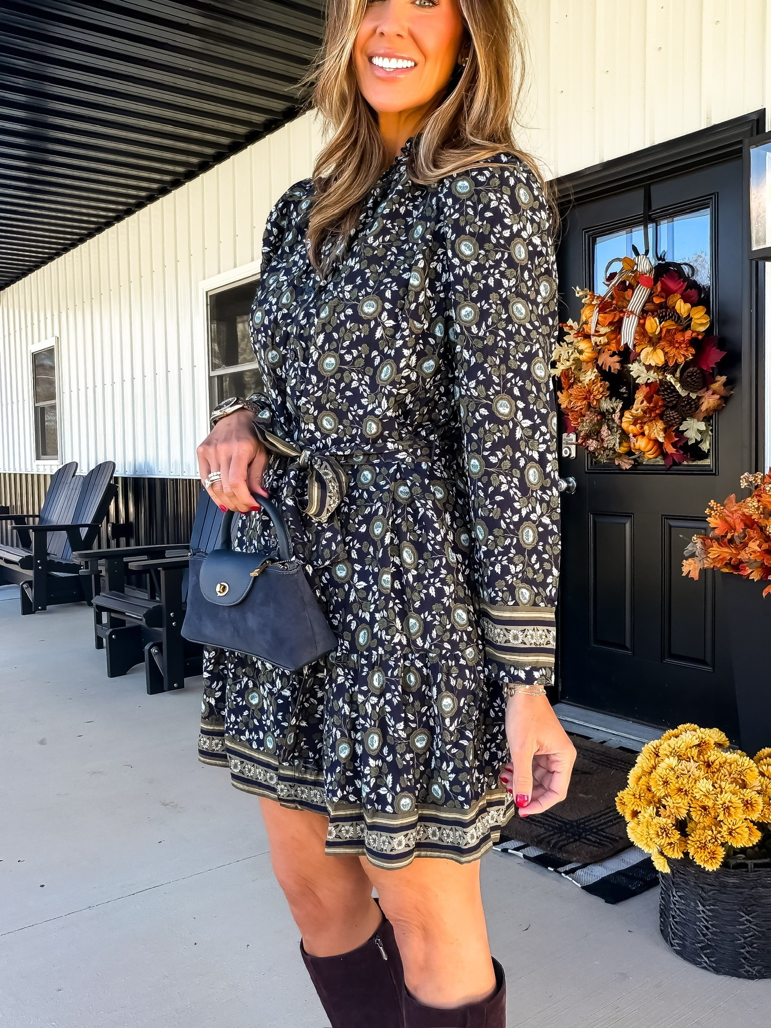 This printed fall dress is so pretty with the tie waist and those little border details! 🤎 I love it with tall suede boots and a navy bag for a different take on fall colors.

printed fall dress, fall mini dress, tall suede boots, navy handbag, tie waist dress, fall outfit ideas, casual fall fashion, autumn dress, women over 40 style, themominstyle