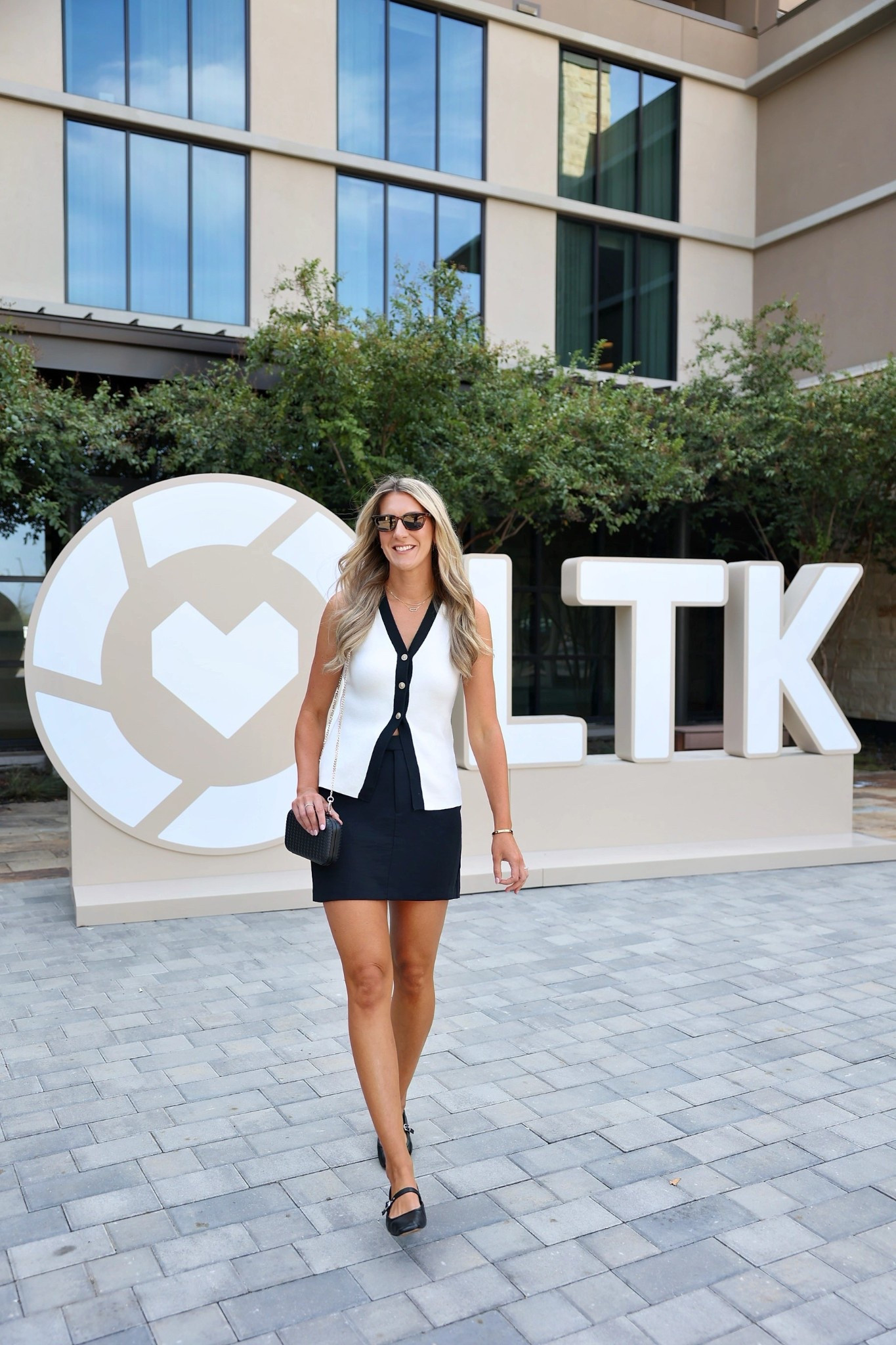 Checking into LTKCon 2025! Wearing my true medium in all! 

Mini skirt isn’t too short and longline vest make the perfect combo! 

#LTKMidsize #LTKCon #LTKSaleAlert