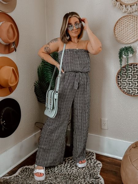 Boho strapless vacation jumpsuit! Stretchy elastic waistband + tie feature. I sized up to an 8, and realized I should have stuck TTS with the 4/6! Platform white sandals run TTS & added some pops of color with teal bag + sunnies! 

#LTKFind #LTKstyletip #LTKSeasonal