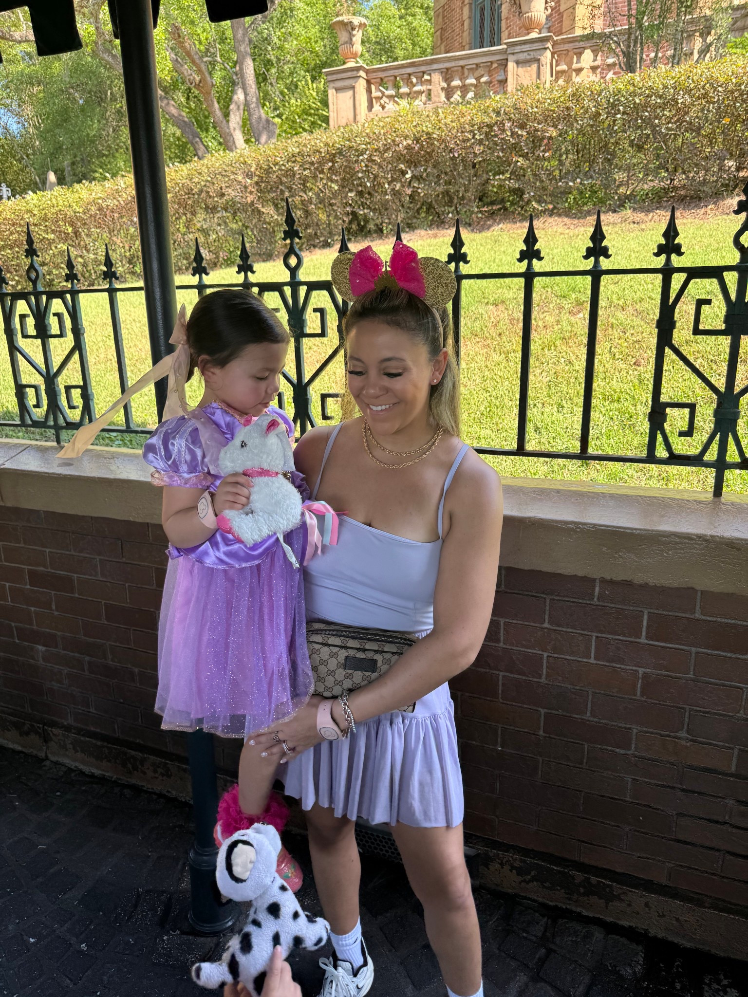 Mommy and me Rapunzel inspired outfits. Disney world outfit. Disneyland outfit. Princess outfit. Mickey Mouse ears. Mommy and me outfits. Mama and me. Gucci Fanny pack. Gucci waist bag. 

#LTKTravel #LTKFamily