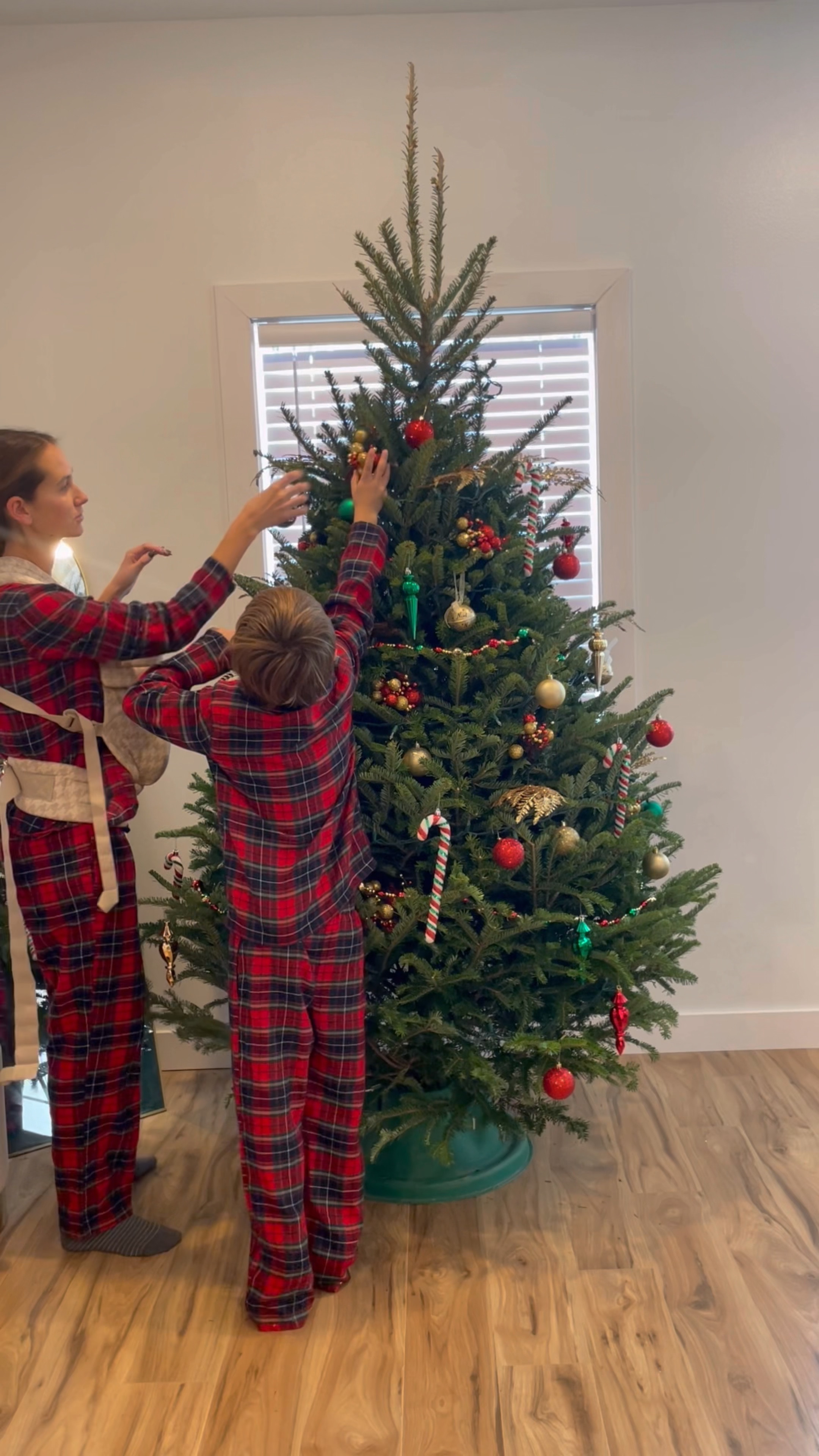 Decorating our Christmas tree in our matching pajamas 

#LTKHoliday #LTKFamily #LTKKids
