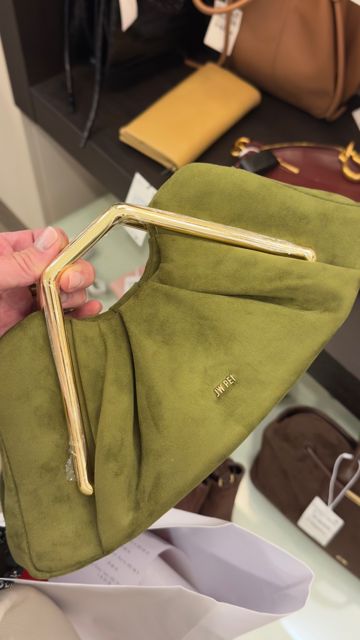 JW Pei's suede shoulder bag in this olive green is chef's kiss — the gold geometric handle takes it from basic to statement piece. 

 #LTKdayinmylife #LTKTravel #LTKWedding