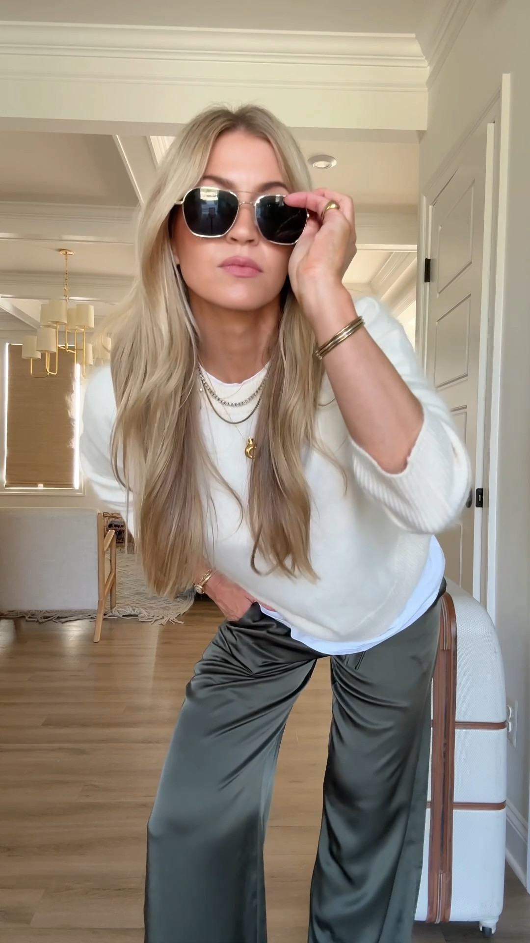 Such a chic and comfortable airport outfit, perfect if you’re traveling for the holidays. Both my sweater and white tee are sold out, but I searched and found really great alternative options for both of them.

Silk pants: run TTS, wearing a small

Gold loafers: sold out, but the alternative pair I linked our even more comfortable! They run true to size and I have tried them on in store and I love them! 

#LTKSeasonal #LTKTravel #LTKootd