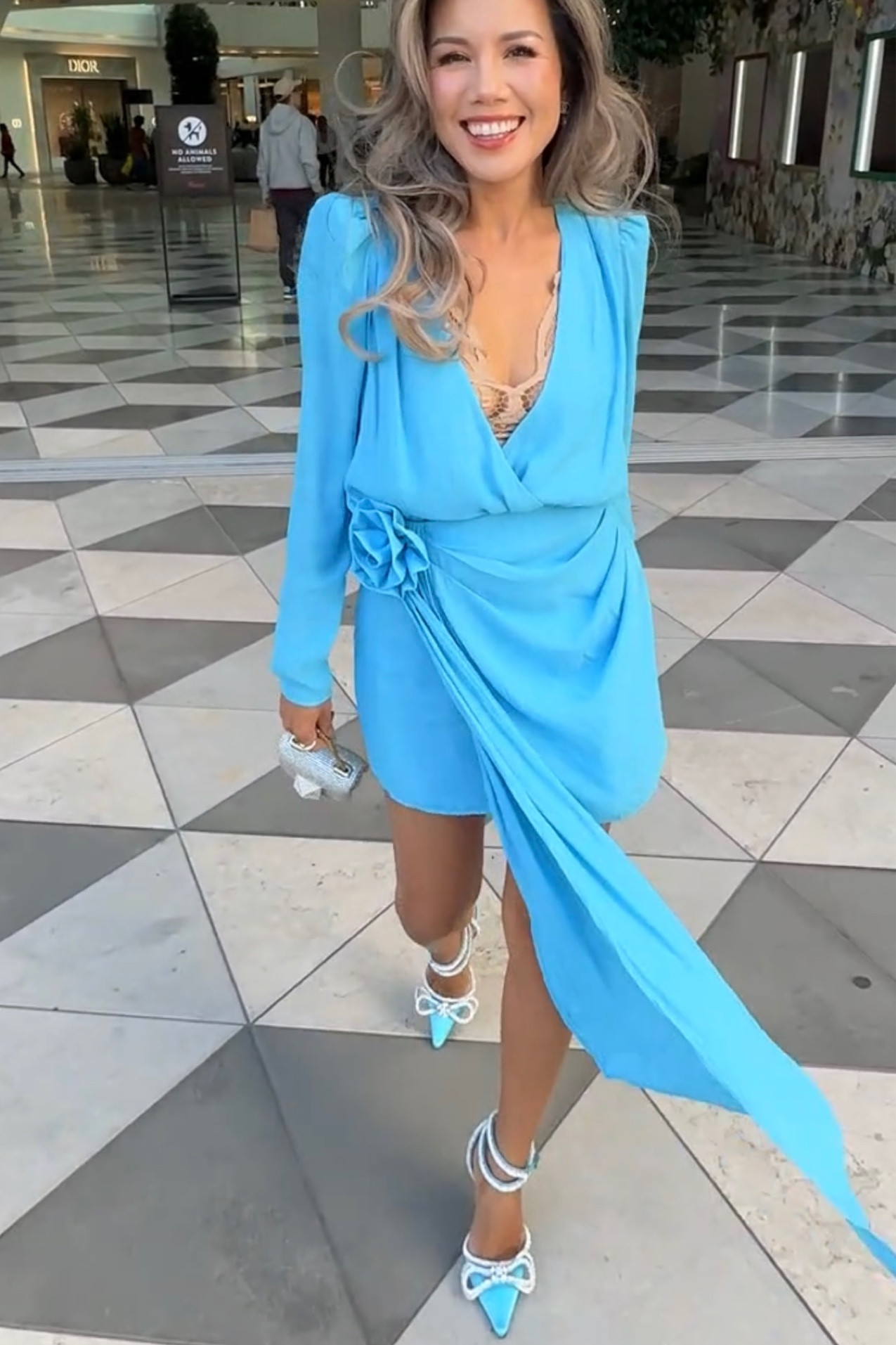Girl night out outfit. Floral fashion trend 2023 with this aqua blue wrap body suit and drapes skirt. Matching light blue pumps from Mach and Mach. One stud micro crystal bag from Valentino.  

#LTKstyletip #LTKitbag #LTKshoecrush