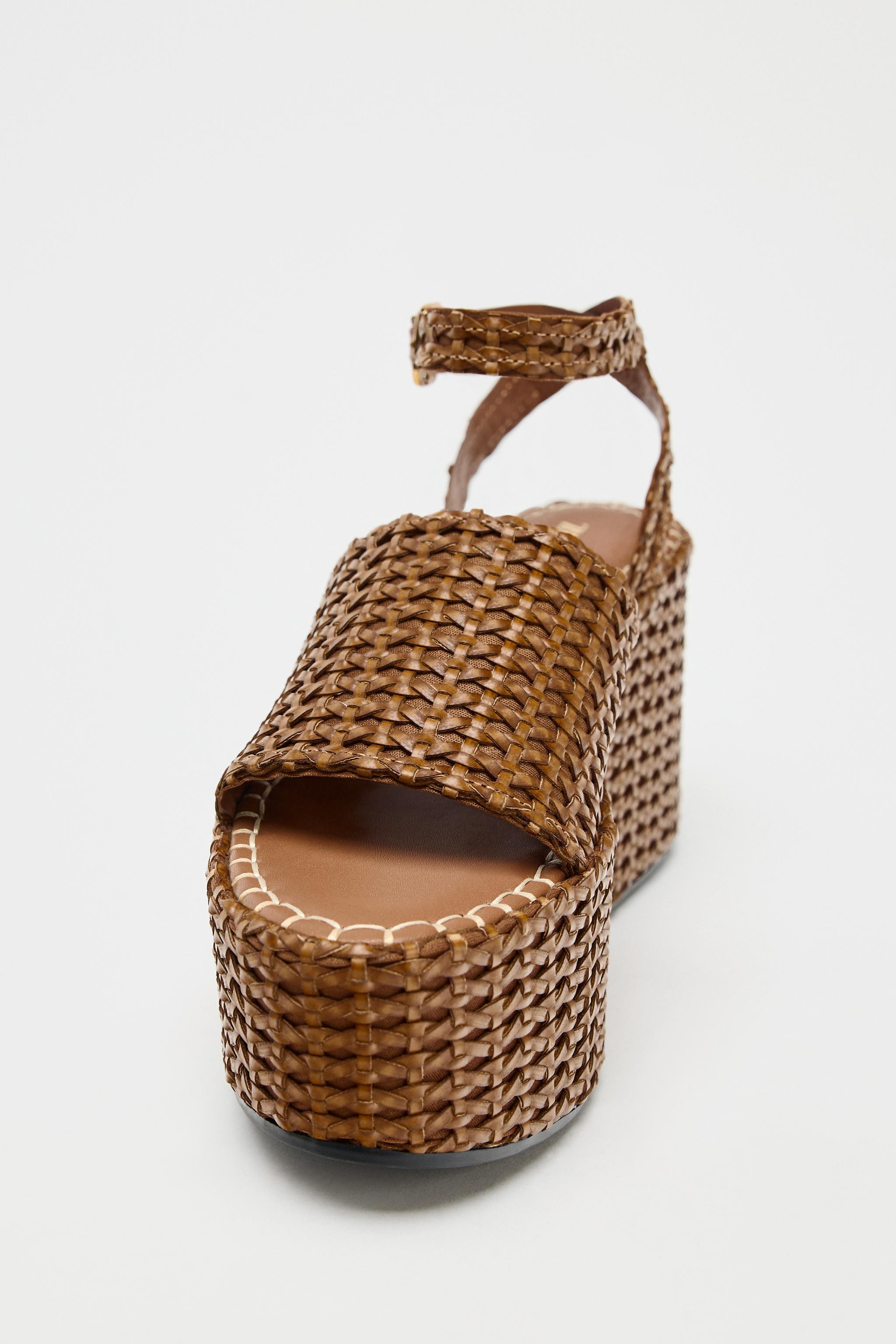Braided platform wedge shoes. Front strap. Ankle strap with buckle closure. Platform sole. Rounde... | Zara US