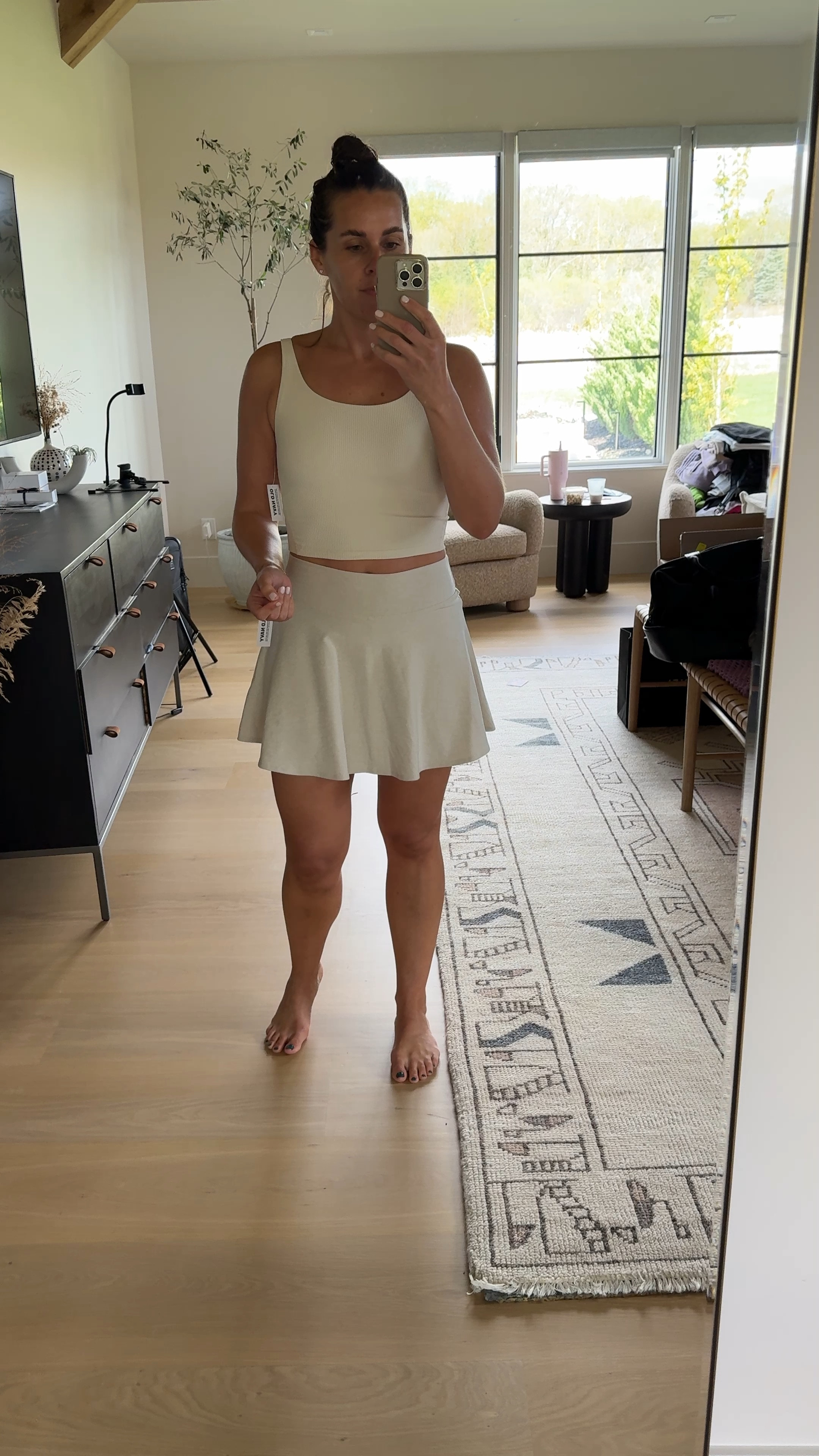 Old Navy athletic set on sale. Obsessed with this one. Color is wish bone. Wearing a medium in both. Skirt is on sale for $15!

#LTKfitness #LTKfindsunder50 #LTKsalealert