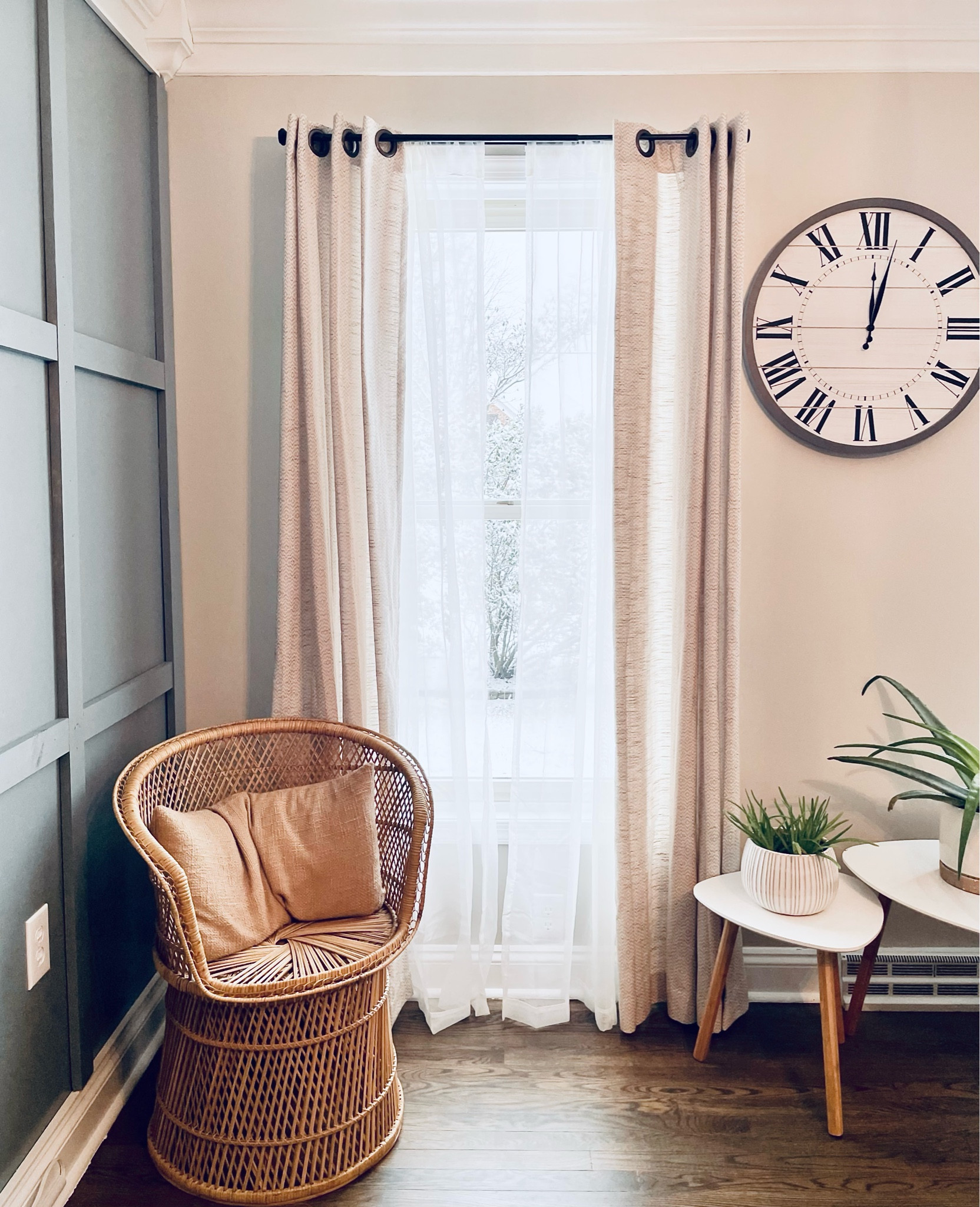 Modern farmhouse home office with accent wall, oversized wall clock, rattan chair, side table set and succulents! 🤍