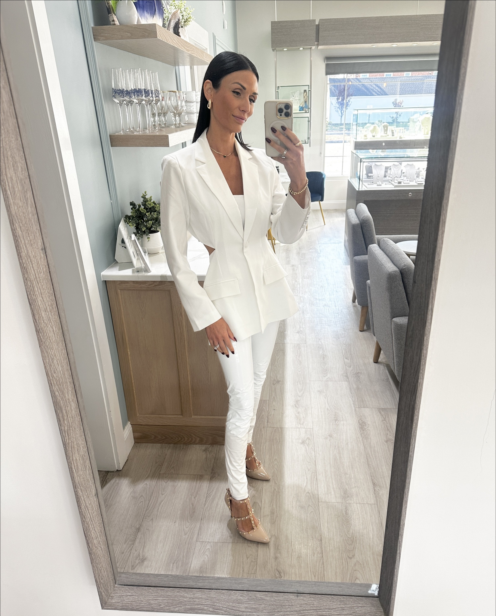 “Winter whites, but make it bold ✨ Rocking sleek white leather leggings with a cut-out blazer that’s all about the perfect fit. Paired with studded Valentino pumps, sleek straight hair, and my favorite chunky gold jewelry for that extra shine.

Who says winter can’t be luxe and edgy? Shop this polished look now on my LTK! ❄️ #WinterWhites #LTKstyle #BoldInGold #WinterChic”

#LTKHoliday 

#LTKSeasonal #LTKShoeCrush