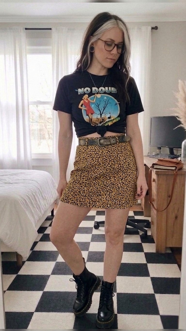 Mixing feminine prints with edgy band tees is my current personality. This high-waisted micro-print skirt is the perfect length to pair with classic combat boots for that "too cool to care" vibe. I tied the No Doubt tee in a front knot to snatch the waist and give it a custom cropped look. Perfect for concerts, coffee dates, or just feeling like a 90s icon.

#LTKootd #LTKSeasonal #LTKMidsize