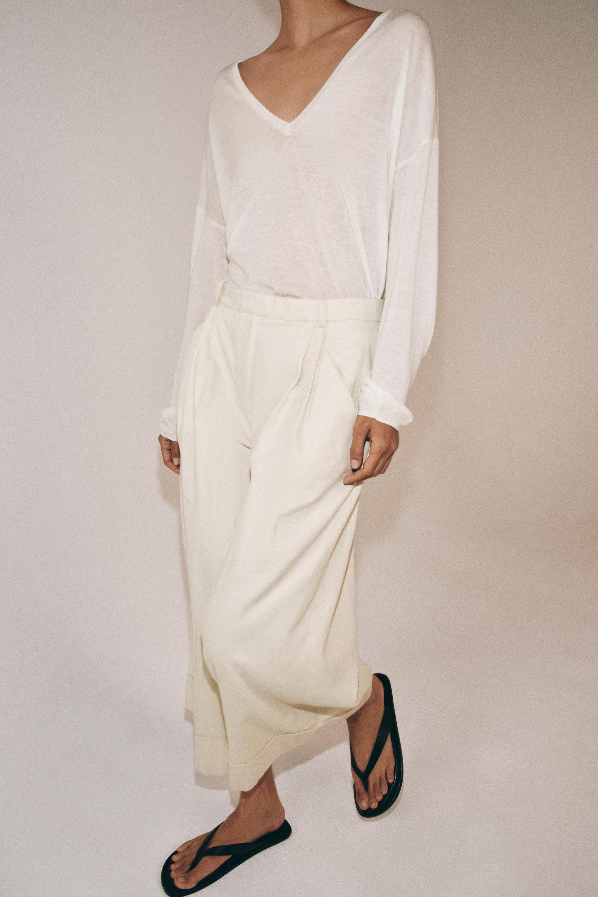 ZARA WOMAN COLLECTIONTrousers made from a linen and cotton blend. Mid-rise and waistband with bel... | Zara UK