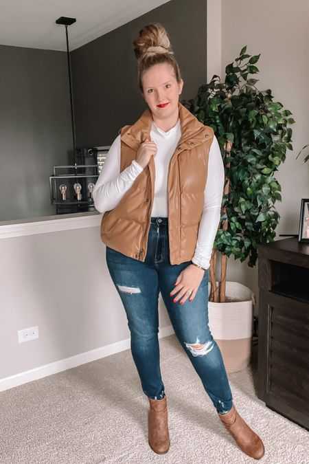 NEW faux leather puffer vest so cute for the 2023 fall to winter season! Classic fall outfit with neutral touches and multiple fabrics to add depth to your style. Dark distressed denim skinny jeans tuck nicely into my neutral heel booties. Love these short boots for the entire cold weather season. So easy to style!

#LTKSeasonal #LTKmidsize #LTKshoecrush