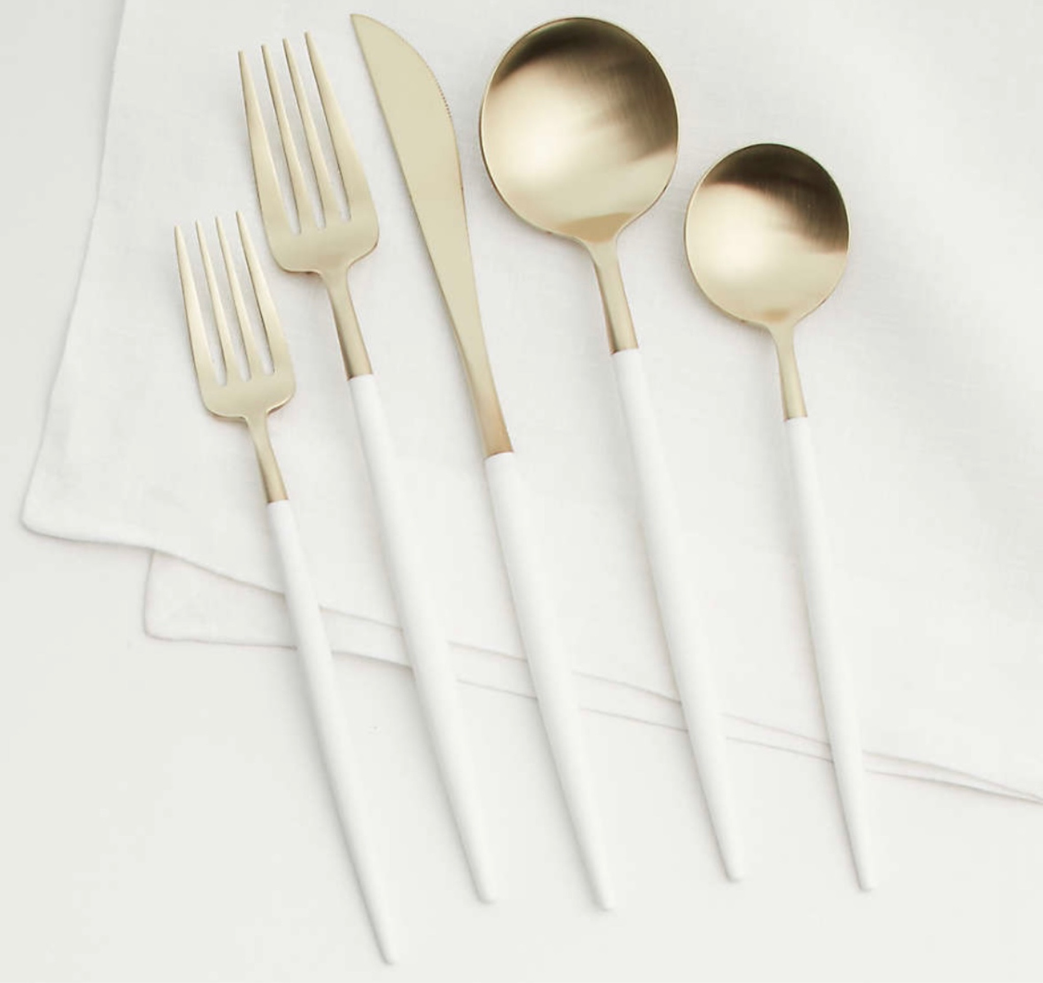 Aero White Champagne 20-Piece Place Setting

Ultra-modern European flatware joins sculptural champagne-gold heads to streamlined, tapered handles in matte white resin. Finished by hand by skilled artisans, the softly golden stainless steel flatware adds unexpected glamour to casual and formal tables. Our exclusive five-piece place setting in white-champagne includes a salad fork, dinner fork, teaspoon, dinner spoon and dinner knife.

#LTKparties #LTKfamily #LTKhome