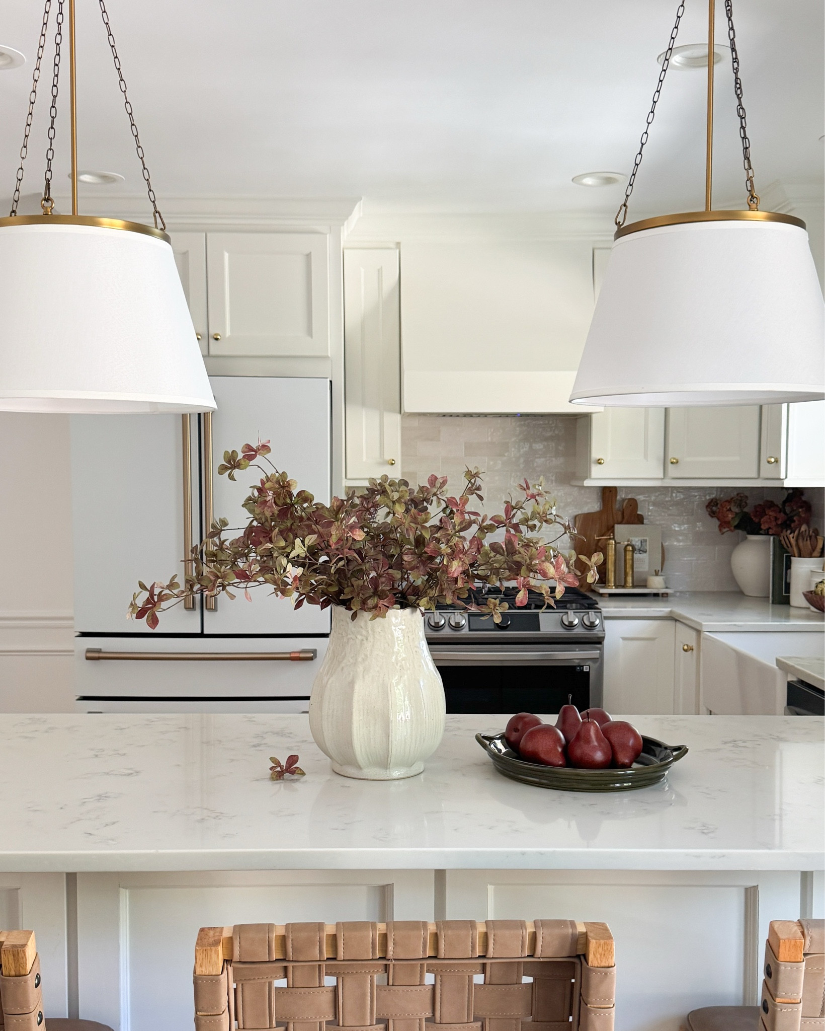 Fall has finally made its way into our kitchen and I can’t believe it’s ALL from Target. 🍂
The moody stems, that pretty green dish, to my latest coffee maker from Haden…simple & easy swaps that made our kitchen  space feel warmer and cozier.

Linked everything for you so you can grab it before it’s gone.  🤎

#FallKitchenDecor #ModernOrganicHome #NeutralHomeDecor #LTKHome #FallHomeStyling #DesignerLookForLess #HomeDecorObsessed #KitchenInspo