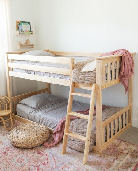 Best beach condo bunk bed. Love the versatility of the scandi style and the shorter ladder. I chose the Naturepedic 2-1 organic mattresses for this bunk (mattresses also in my shop—you may be able to get them on 20% off sale around holidays). 

I love the washable Revival “Gambit” rug in evergreen styled with this set. 