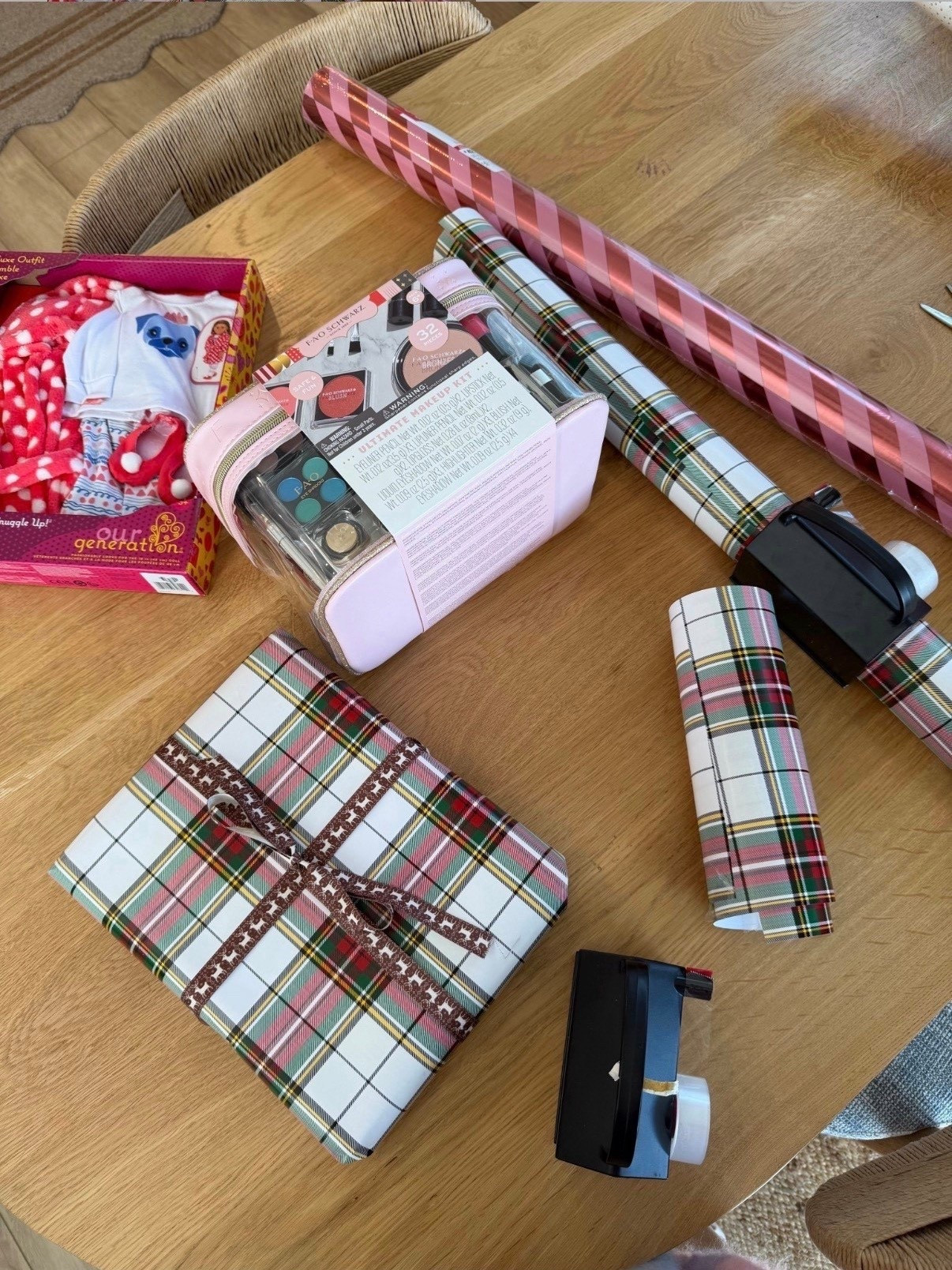 Proof that the wrapping is half the gift 🎁✨
I love having a stash of pretty wrapping paper, gift bags, and a good tape dispenser on hand — it makes even last-minute gifts feel thoughtful and pulled togethere together. These classic plaid papers are my go-to every year, and the tape runner is a total game-changer (no fighting with tape while wrapping on the floor).

🎄 Simple, festive, and actually makes wrapping fun.
