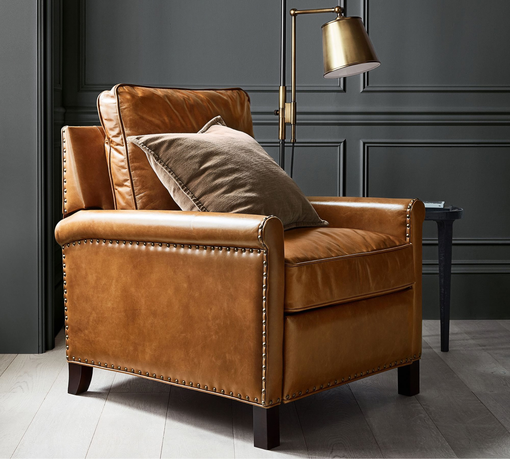 Here’s a timeless design that will make your guests swoon! 
The leather roll arm recliner is a transitional piece made to work with your style. Paired with a beautiful throw pillow and statement floor lamp, this bland corner just turned into a cozy nook that dreams are made of  

#LTKsalealert #LTKhome #LTKfamily