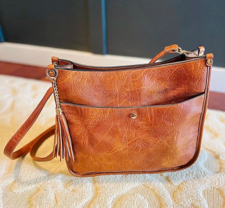 My crossbody bag is back!! I love that it has a top zipper, and storage options on both sides + a pocket on the inside - lots of space for everything I carry! It also comes with two strap types to coordinate with your outfits/moods! 🤩

#amazon #fallbag #fallaccessories

#LTKfindsunder50 #LTKSeasonal #LTKitbag