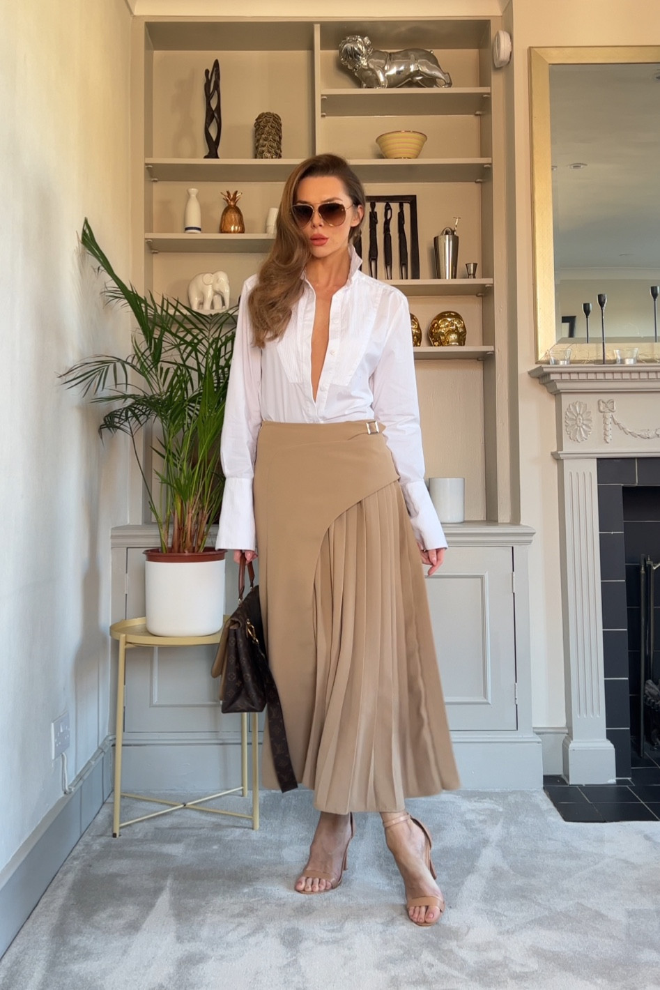 - Karen Millen tan pleated midi skirt.
- Karen Millen white shirt.

#LTKSeasonal #LTKworkwear #LTKFind