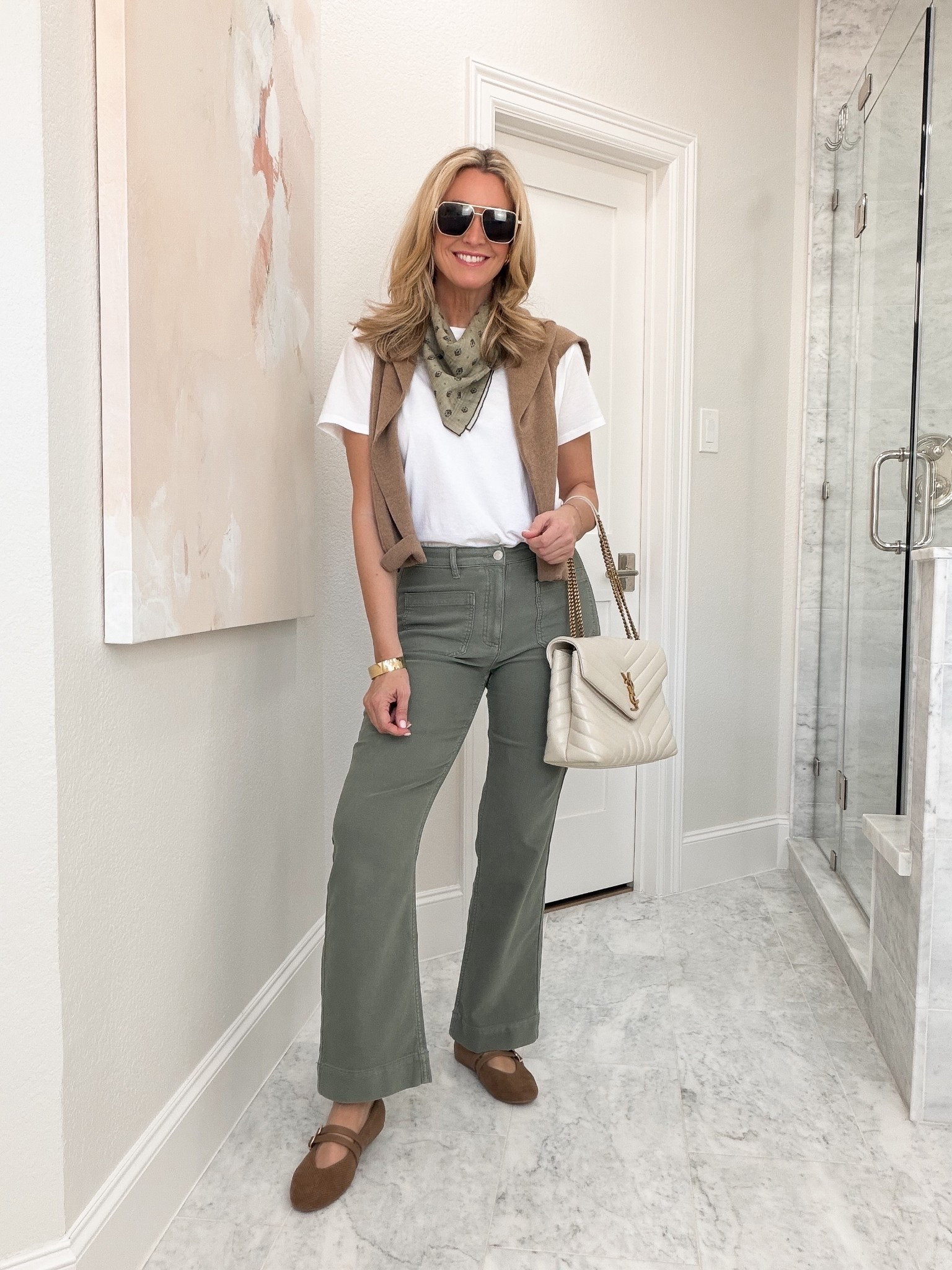 I’m ready for fall clothes, but the weather definitely isn’t there yet. Green jeans with a white tee let me lean into the season now, and I can add the sweater once the temperature finally cooperates.

Green jeans, fall outfit, transitional style, wide leg jeans, white tee outfit, ballet flats, casual fall style, summer to fall outfit, everyday fashion, neutral accessories, HauteandHumid

#LTKootd #LTKdayinmylife #LTKSeasonal