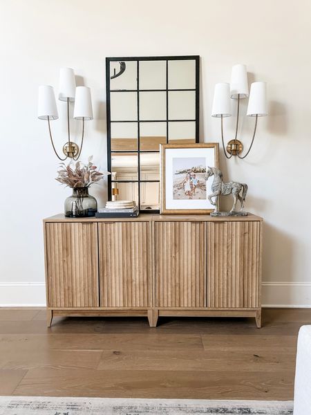 Our cabinet is still sold out, but I found some similar ones! 







Storage cabinet
Media cabinet
Console
Buffet
Media console 
Family room
Large mirror
Sconces
Living room
Family room

