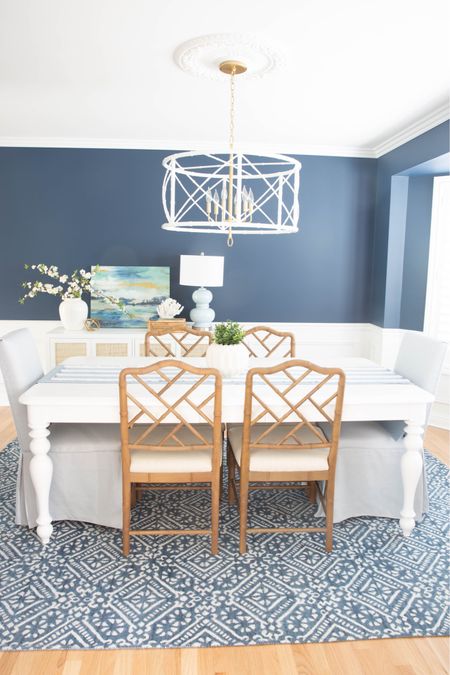 Coastal decor, coastal furniture, coastal dining room, dining room style, navy walls, white table, dining room chairs, Chippendale chairs, Parsons chairs, bamboo chandelier, white chandelier, blue dining room, blue and white



#LTKsalealert #LTKhome #LTKunder100