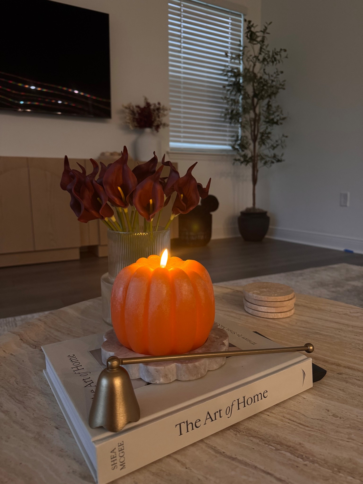 Sweater weather essentials: coffee, candles, and a glowing pumpkin on the coffee table 🧣🎃 #LTKHome #CozyFall

#LTKHome