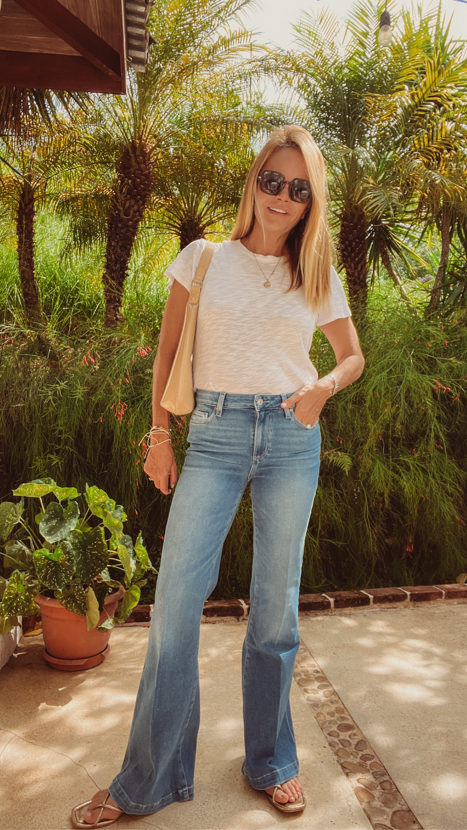 OOTD, casual outfit. High rise flare jeans and  white t-shirt. Paige Jeans run TTS.  Soft, lots of give, comfortable. ATM Collection t-shirt is super soft, runs TTS, best fit and fabric. 

#LTKunder100 #LTKstyletip #LTKFind