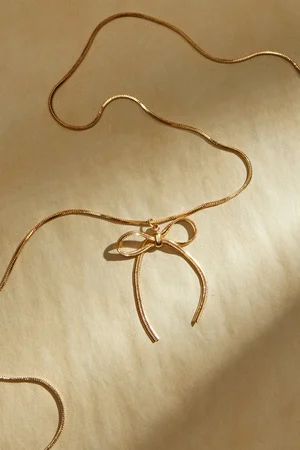 Dainty Bow Necklace in Gold | Altar'd State | Altar'd State