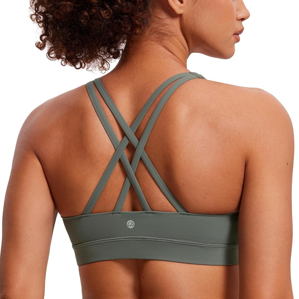 CRZ YOGA Women's Strappy Sports Bras Fitness Workout Padded Yoga Top Criss Cross Back Cami | Amazon (US)