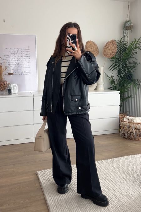 Spring outfit inspiration styling oversized leather jacket with straight leg tailored trousers and striped top for a classic spring outfit for the colder days. Teamed with dr marten Jadon boots! 

#LTKfindsunder50 #LTKSeasonal #LTKstyletip