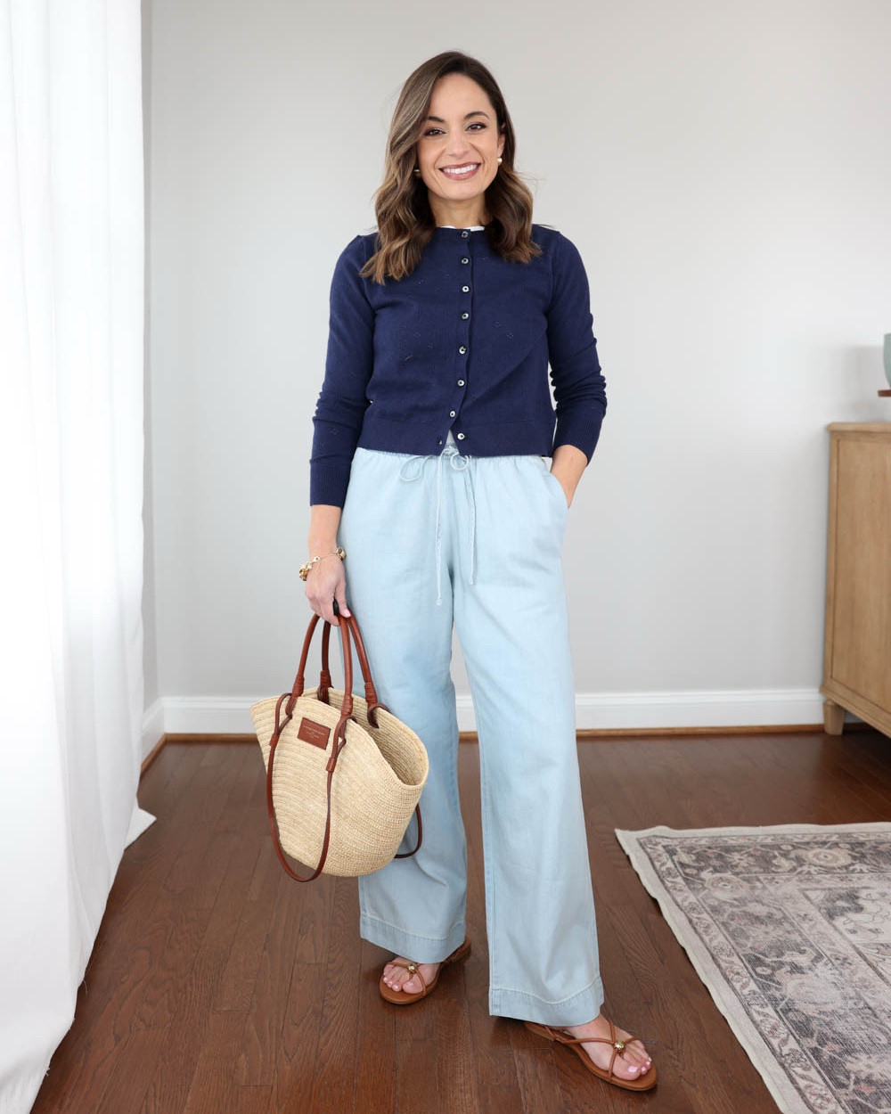 Under $40 Old Navy cardigan styled three ways for Spring & Summer!

Navy cardigan (Old Navy): petite xs

Outfit 1:
LOFT Sawyer Pants: petite xxs - 9” rise, 27” inseam. TTS 
White tank top (Quince): xs 
Straw bag (Sezane)
Shoes: tts

Outfit 2:
Blue tank top (Quince): xs 
Linen shorts (Quince): 0 - fully lined
Ballet flats: tts 

Outfit 3:
Light wash jeans (J.Crew Factory): 24 classic - 26.5” inseam
Blue tank top (Quince): xs
Ballet flats: tts

My measurements for reference: I’m 4’10” and 105lbs. My bust, waist, and hip measurement is 32”, 24”, and 36”.

#LTKPetite #LTKSeasonal #LTKSaleAlert
