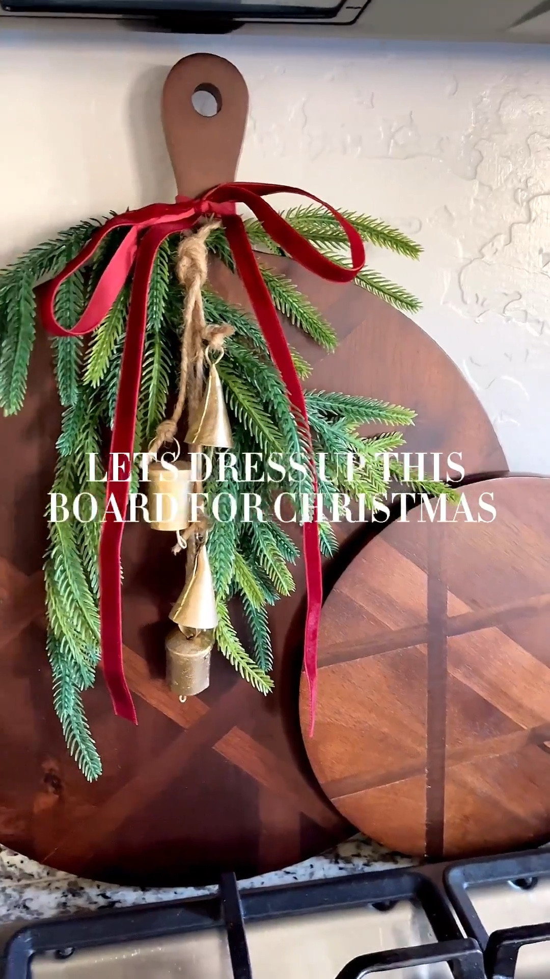 Let’s dress up this board for Christmas!  Follow @lifeinmyarizonahome on Instagram for more holiday ideas and inspiration. 

Sharing a simple idea to dress up any wood handled board in your kitchen that makes such a festive impact!  
I used one 24 inch Norfolk stem with the stem folded back, velvet ribbon, and these adorable gold bells that I attached together with jute string.  I’m loving these bells that can be added as decor around your home or tied onto a gift. I definitely plan on making a few more of these hanging bells!

#christmasdecor #holidaydecor #holidaykitchen #simplediy 

#LTKHoliday #LTKHome #LTKSeasonal
