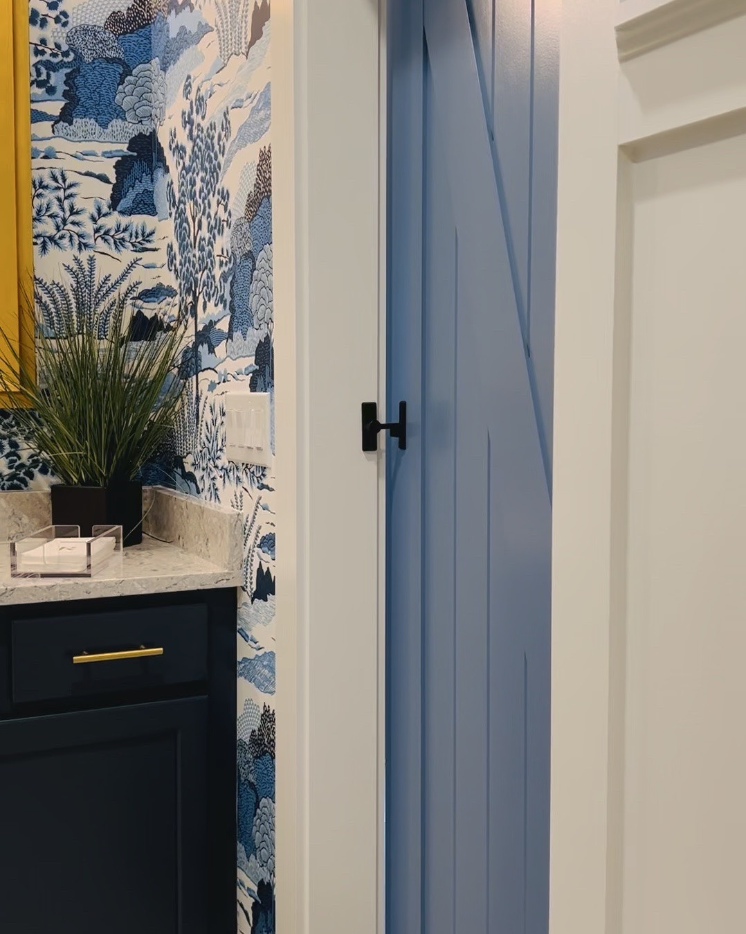 Polished coastal details that make a space feel custom 🤍
This little hallway moment might be one of my favorites—layering pattern, paint, and hardware to create something that feels elevated but still livable.

The wallpaper is Thibaut Daintree in Navy (a forever classic 🌿), paired with a freshly painted barn door in Sherwin Williams Azurite Blue for that rich, moody contrast. And the finishing touch? This charming koi towel hook from Anthropologie—because it’s always the small details that make the biggest impact.

Everything is linked here for you to recreate the look ✨

#LTKhome #coastalstyle #wallpaperlove #thibautwallpaper #coastalhome #interiordetails #barnstyle #blueandwhite #classicwithatwist