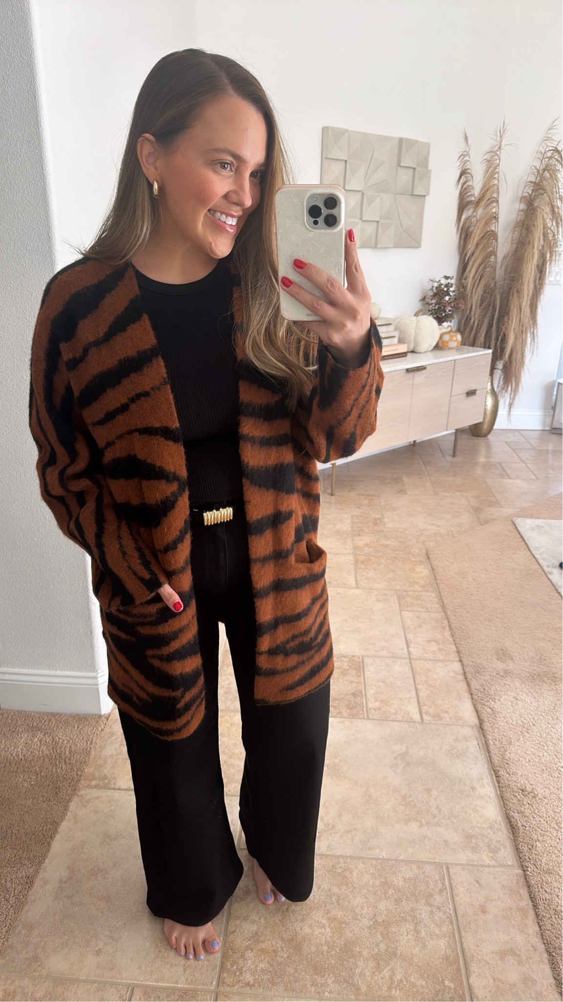 love this tiger print cardigan! i got size medium. 28 in the jeans and large in the tank  