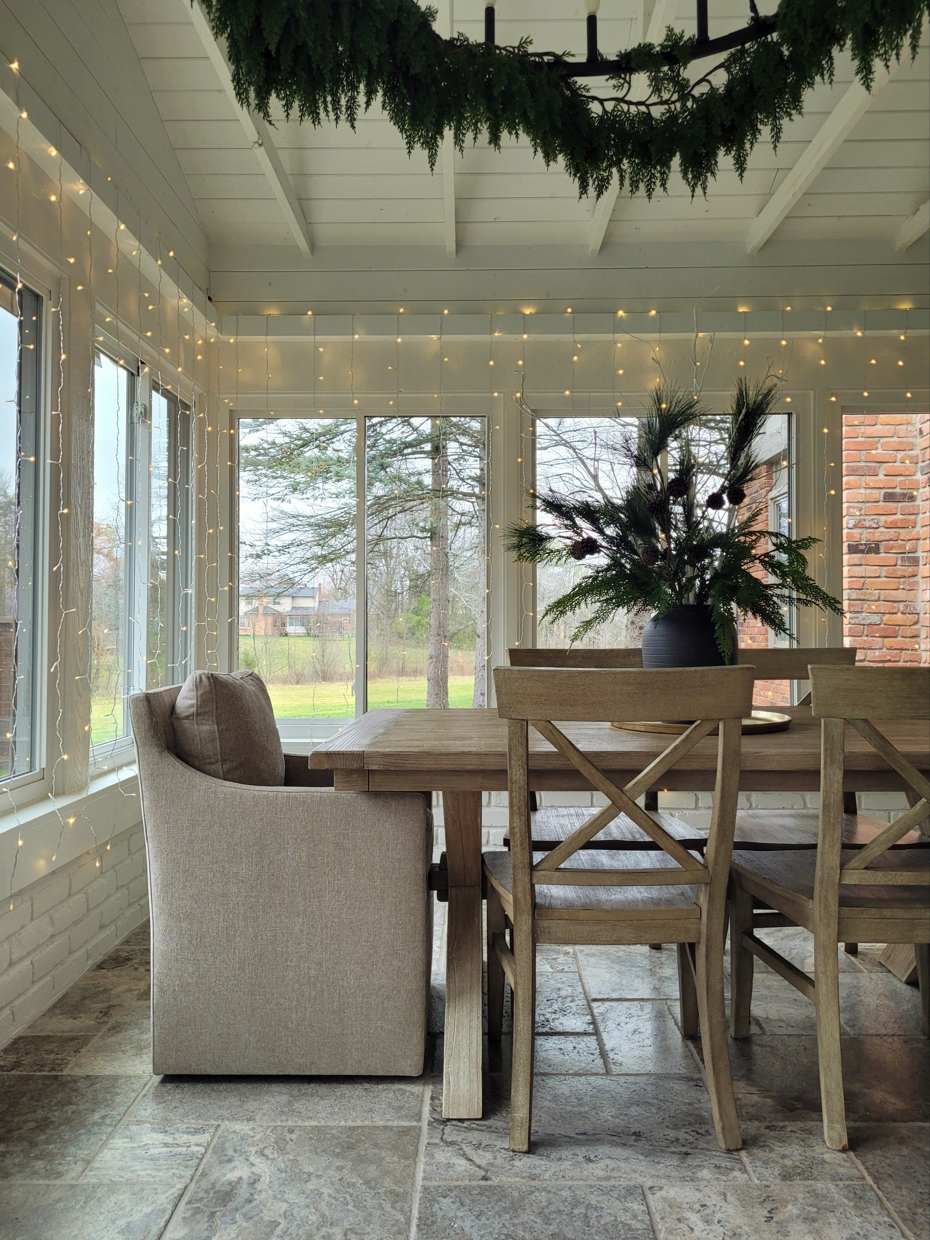 Holiday dining room with LED string lights, upholstered dining chairs,  and an oversized chandelier with garland - a new addition to our Christmas decor this year! 

#LTKCyberWeek #LTKHoliday #LTKHome