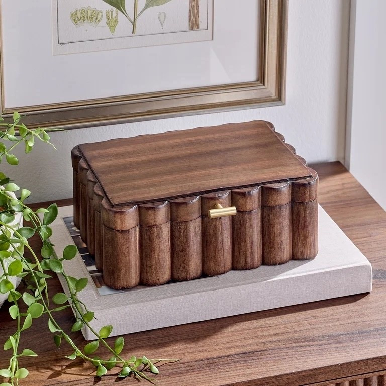 The Better Homes & Gardens scalloped wooden jewelry box is a stylish storage box for your small items. It has a scalloped edge and a natural wood finish that adds charm to any room. Use it to store rings, earrings, bracelets and small keepsakes. This decorative box fits well on a dresser, vanity or nightstand and brings a warm, timeless look to your home

#LTKHome #LTKSeasonal #LTKmomlife