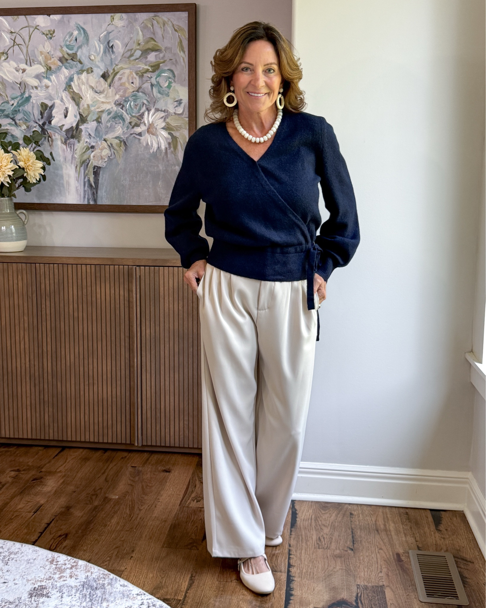 How to Style Cream Pants for Fall

Cream pants don’t have to disappear when summer ends. Pair them with a rich navy wrap sweater for an easy fall color combination that feels polished without being dressy. Add simple flats and statement jewelry for an outfit that works for dinner, the office or an everyday elevated look.

#over50style #falloutfit #creampants #casualchic #fallstyle