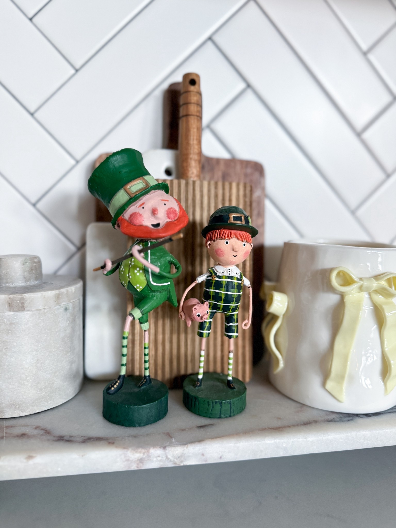 These Lori Mitchell St. Patrick’s Day figurines have my whole heart. I look forward to pulling them out every year! They are so charming & the detail on each one is just unreal. They style so well on a kitchen counter or shelf & instantly make a space feel festive without being overdone. If you’re not collecting Lori Mitchell yet, this is your sign to start. Linked for you below!

Lori Mitchell figurines - St. Patrick’s Day decor - holiday figurines - folk art collectibles - St. Patrick’s Day tabletop decor - seasonal home decor - kitchen shelf styling - holiday home decor - leprechaun figurines - cute St. Patrick’s Day decor

#LTKU #LTKSeasonal #LTKHome