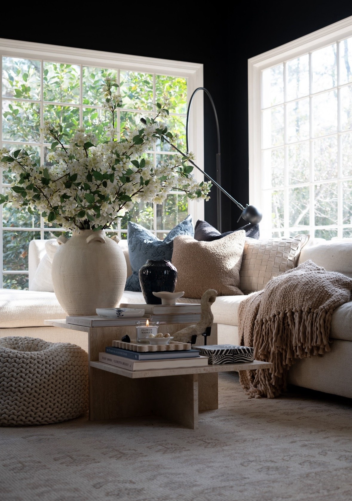 OMG you guys I am seriously freaking out over this corner. The spring blossoms, the oversized ceramic vase, the marble coffee table styling, the cozy textures, and that soft blue accent pillow moment… I cannot. The sunlight pouring in makes the whole neutral living room feel like a dreamy little spring sanctuary.

#LTKSpringSale #LTKHome #LTKSaleAlert