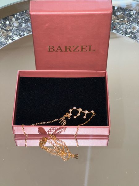 I just got this stunning personalized necklace with my zodiac sign on it, and I can't get enough of it! The gold plating and shiny stones are absolutely beautiful. I think it would make a perfect Mother's Day gift for your mom or any woman in your life. Check it out! 🎁✨

#LTKstyletip #LTKfindsunder50 #LTKsalealert